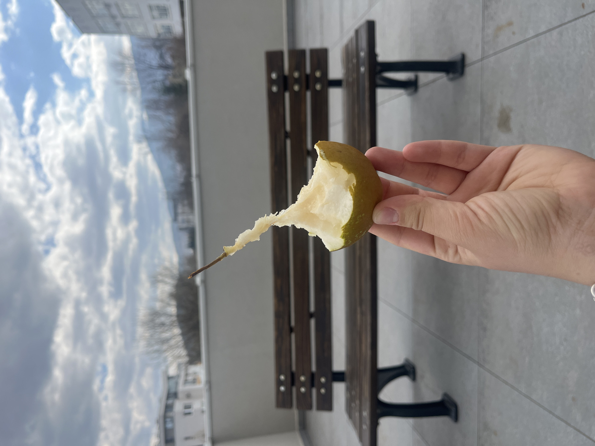 Person documents eating pear at Sofia university campus