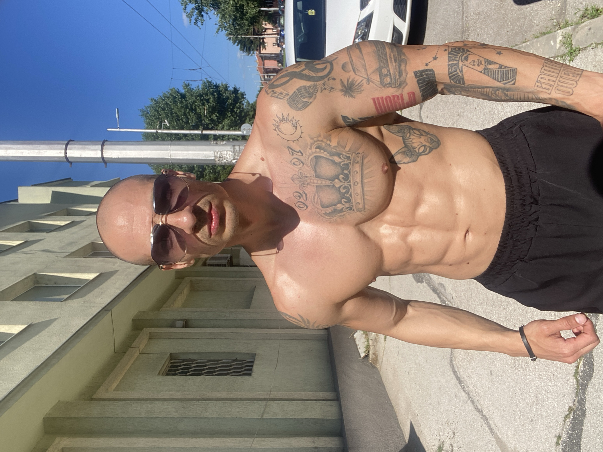 Tattooed man photographed at gym, outdoor locations in Pleven