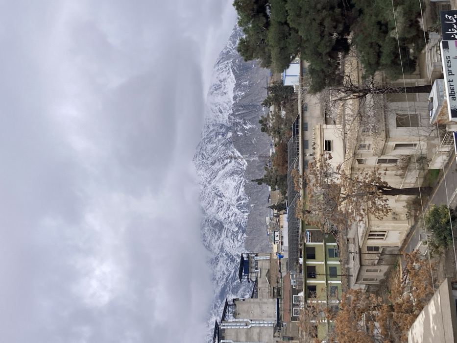 News crews broadcast from Quetta rooftops amid snowy mountain backdrop