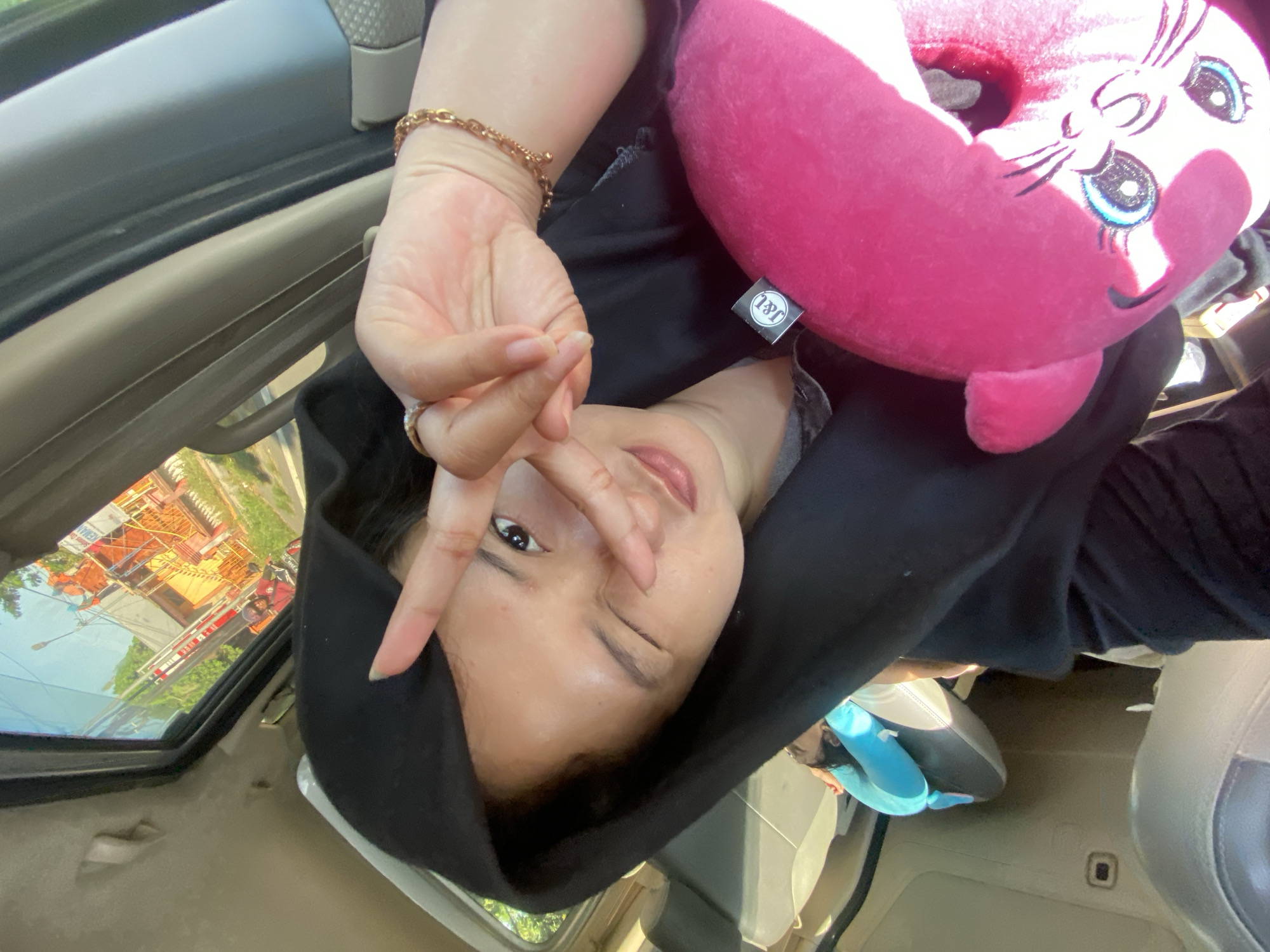 Peace sign selfie snapped inside a vehicle in Gayaman
