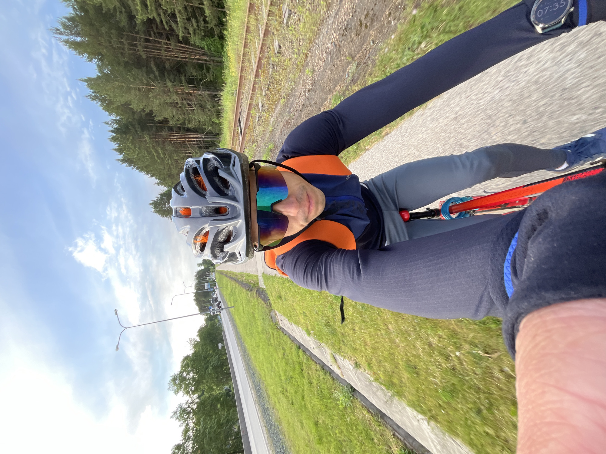 Early morning cyclist rides abandoned railway path in Chaikovsky