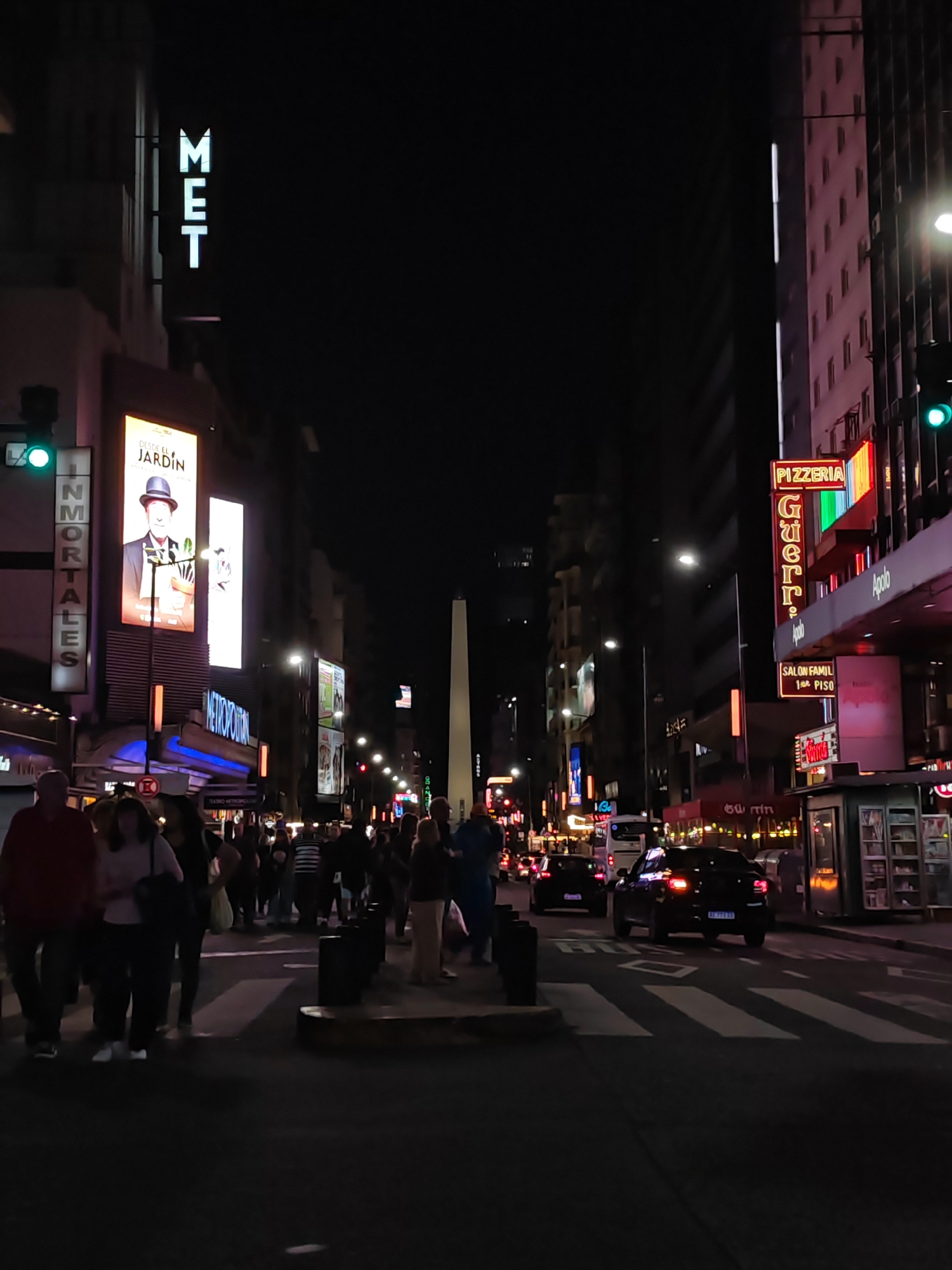 Evening pedestrian crossing near Buenos Aires Obelisco monument