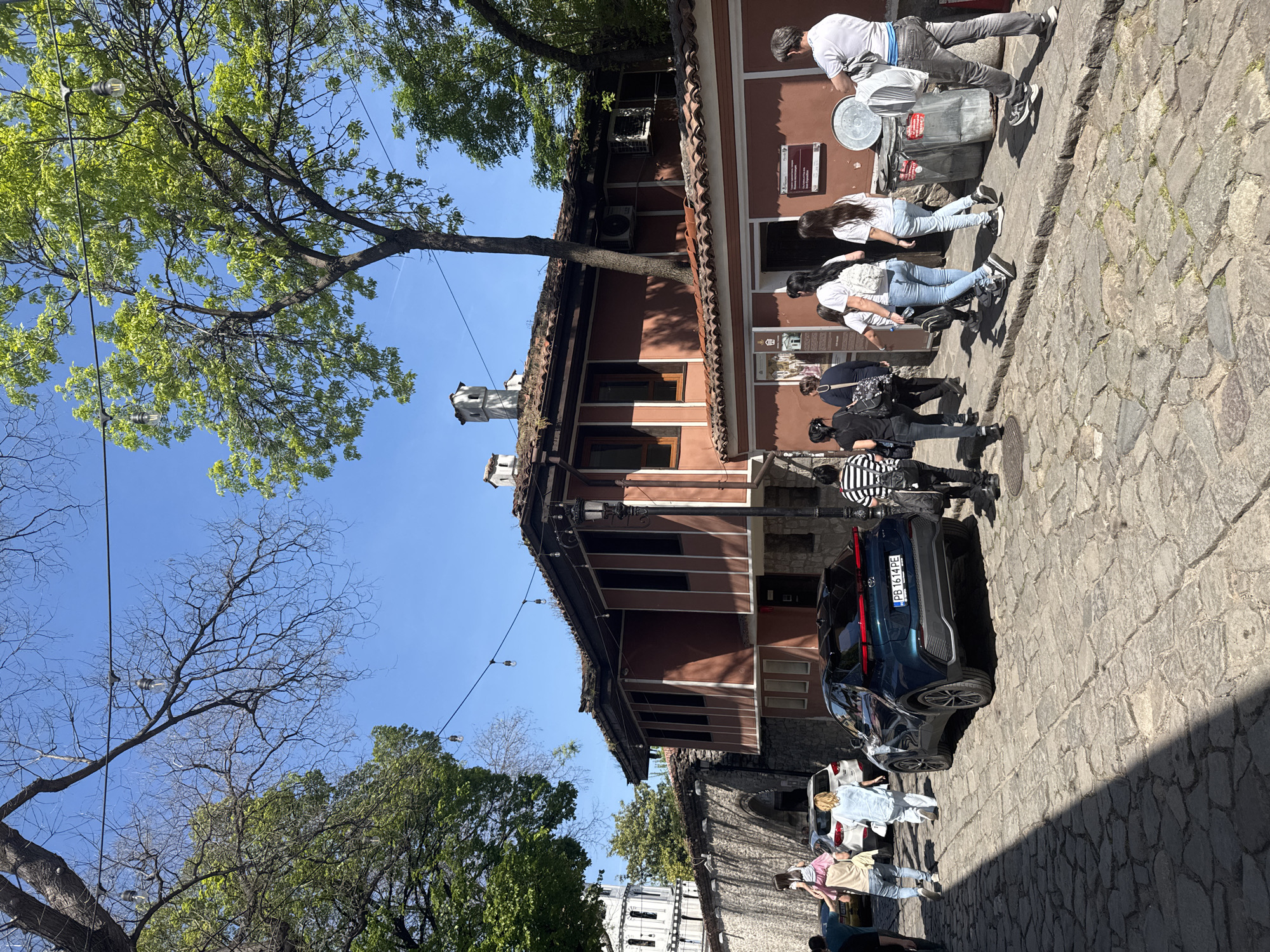 Street scene captured in Plovdiv showing terracotta building