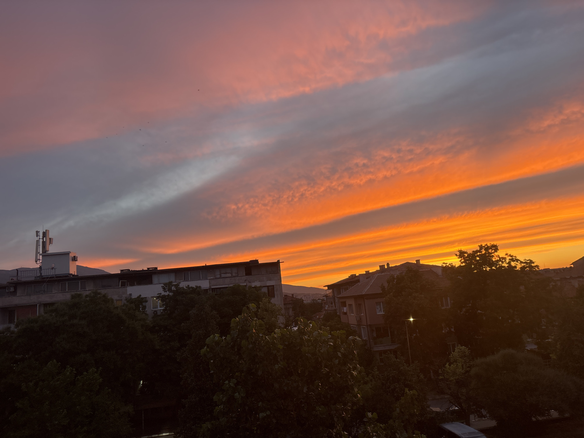 Vivid urban sunset captured from multiple angles at dusk