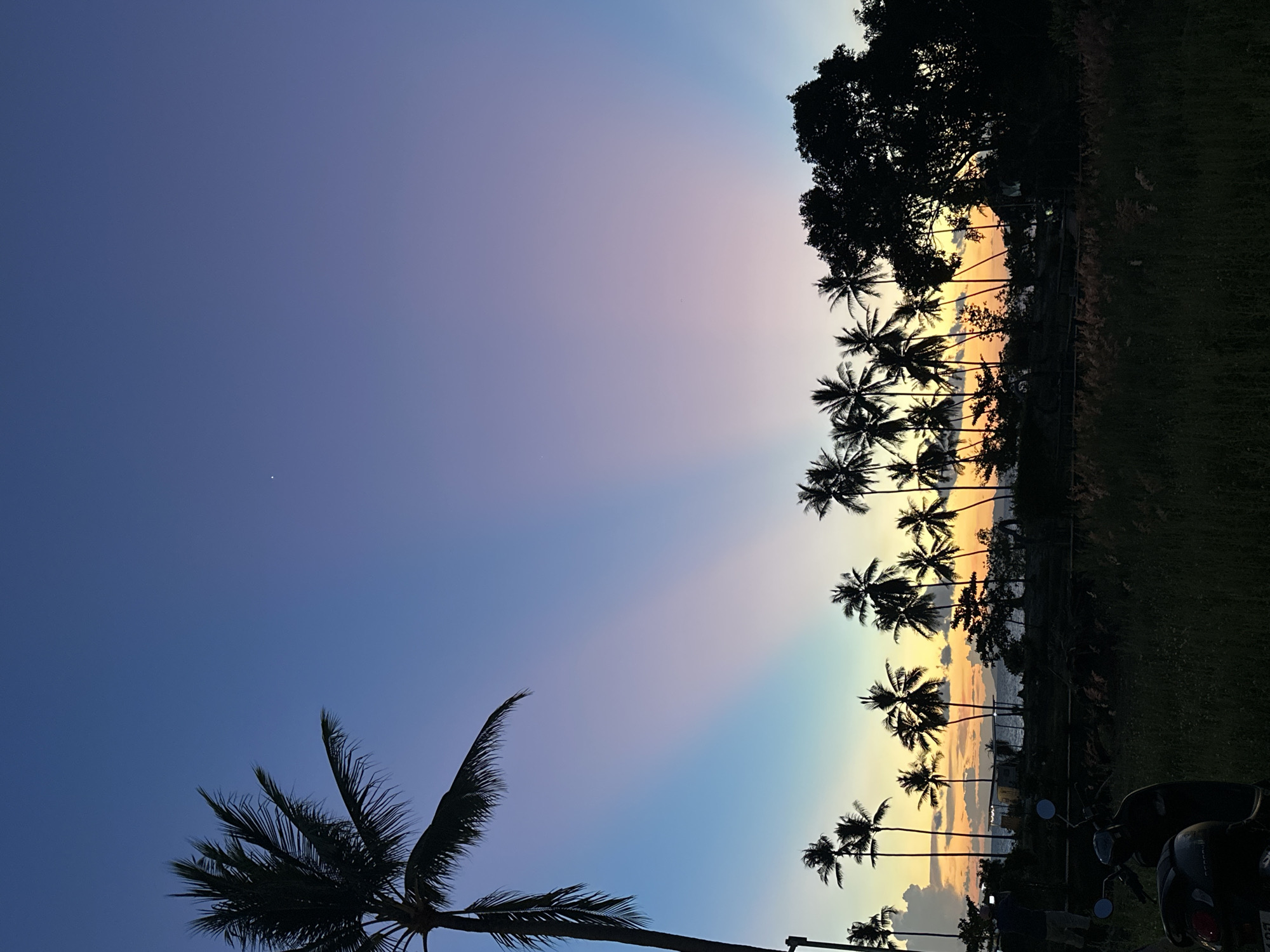 Dusk in Baan Taling Ngam: palms, spirit houses, and a parked Hilux