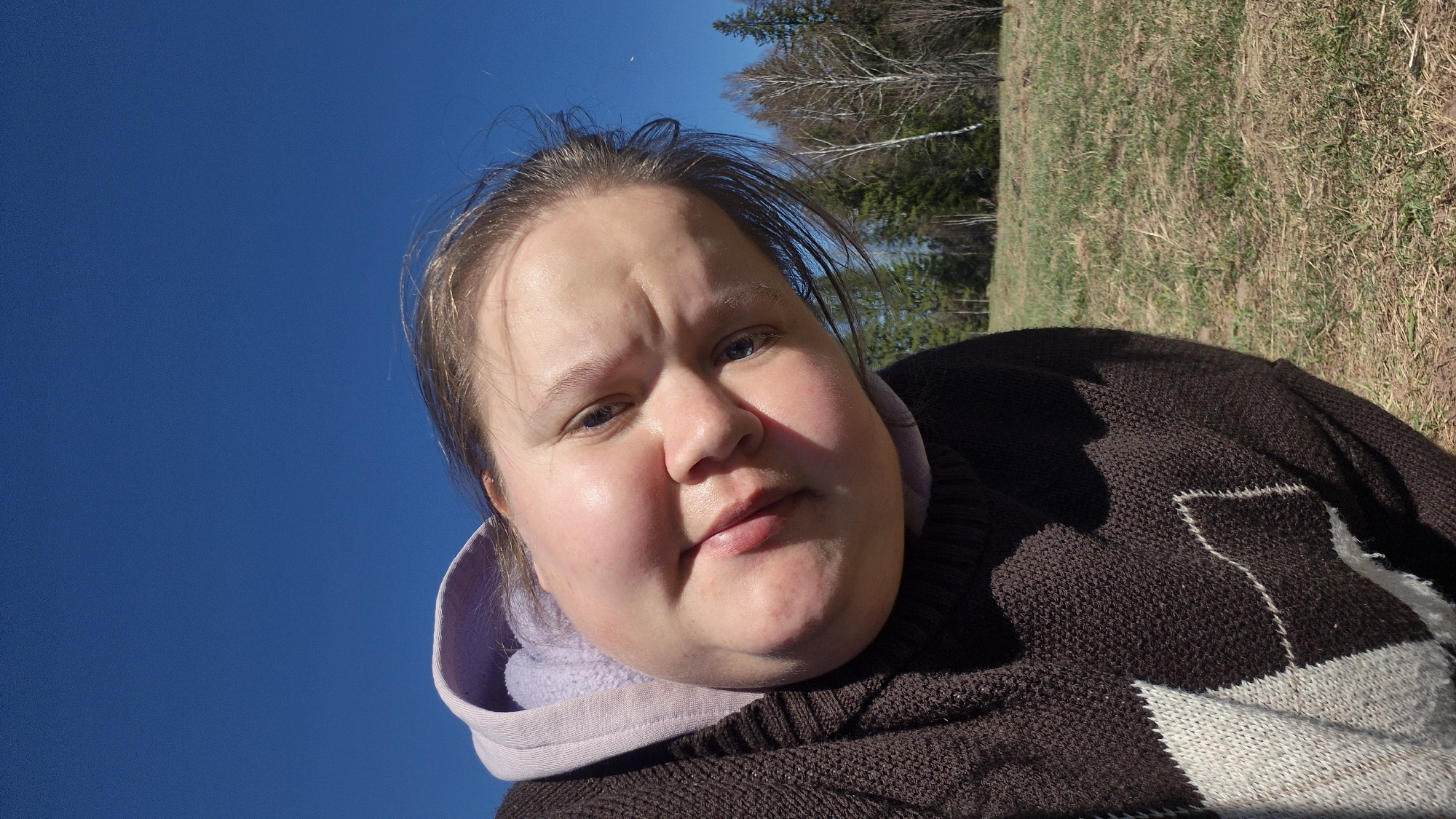 Woman takes outdoor selfies in Russian countryside with local farm life