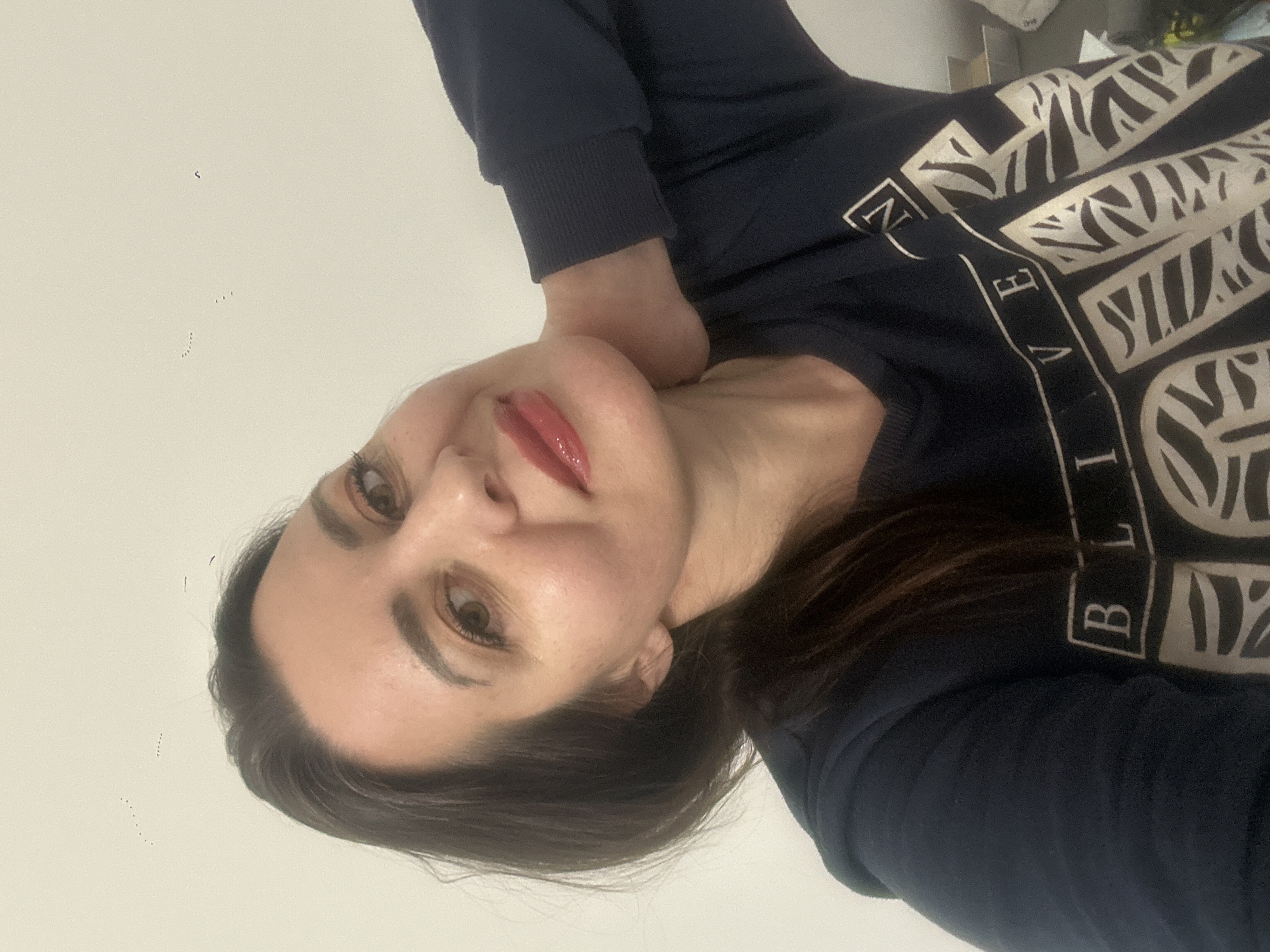 Woman photographed twice in Riga wearing 'BELIEVE' shirt