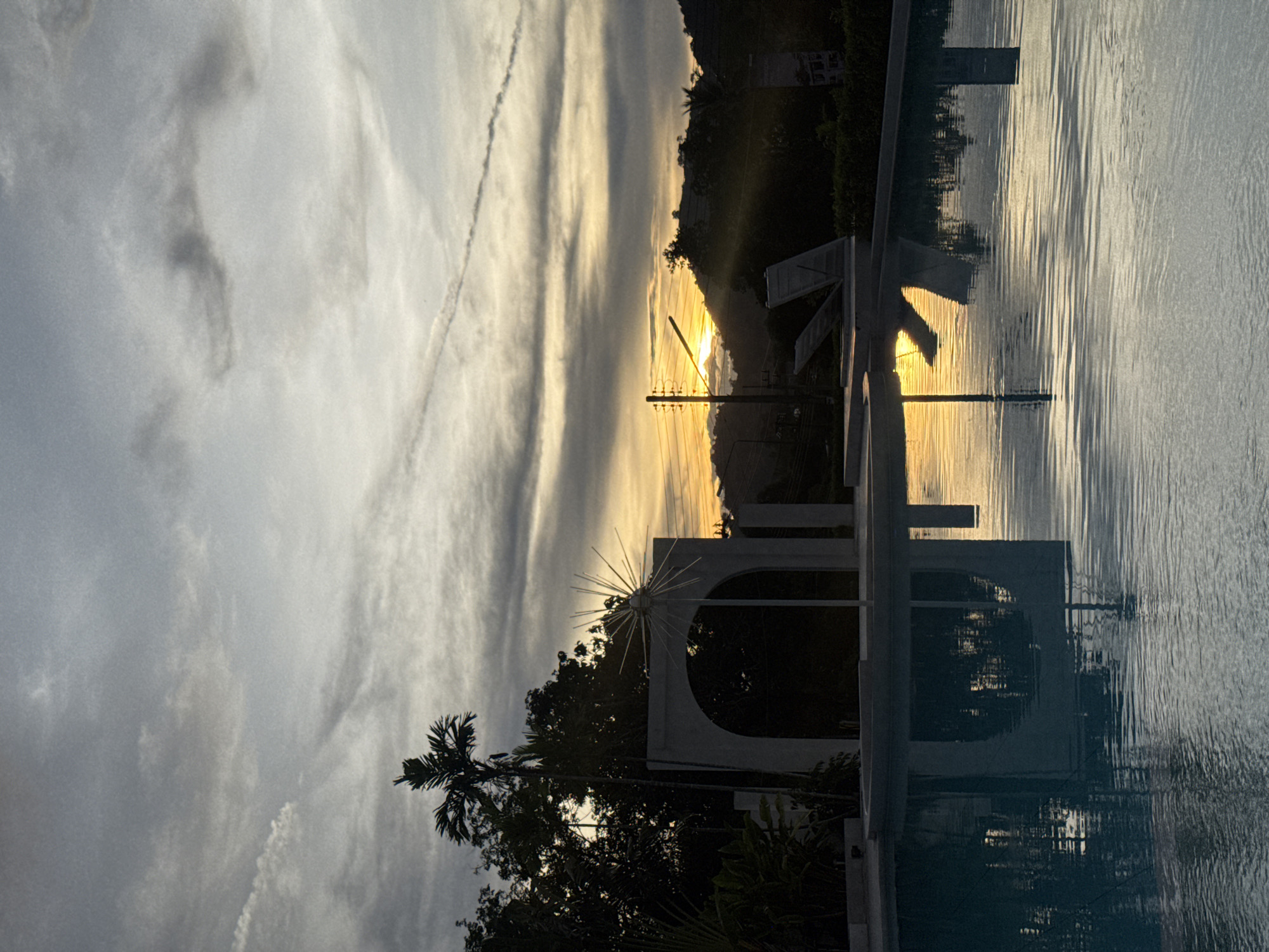 Sunset reflection captured near ornamental structure in Pa Khlok