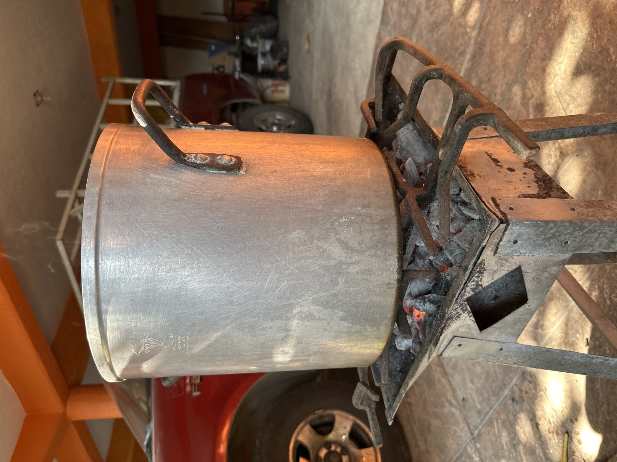 Outdoor cooking scene documented in Acapulco garage area