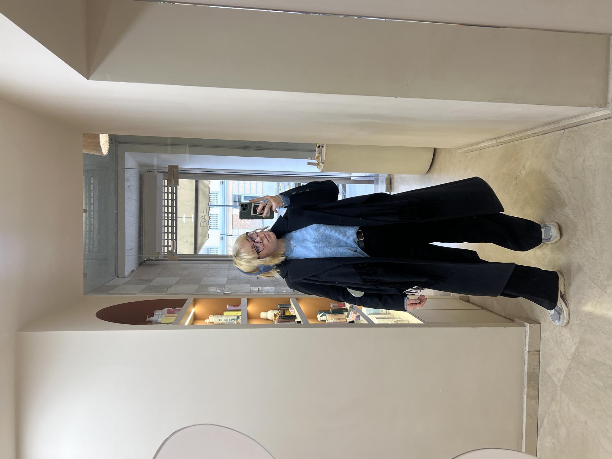 Woman takes selfie in Odesa hallway