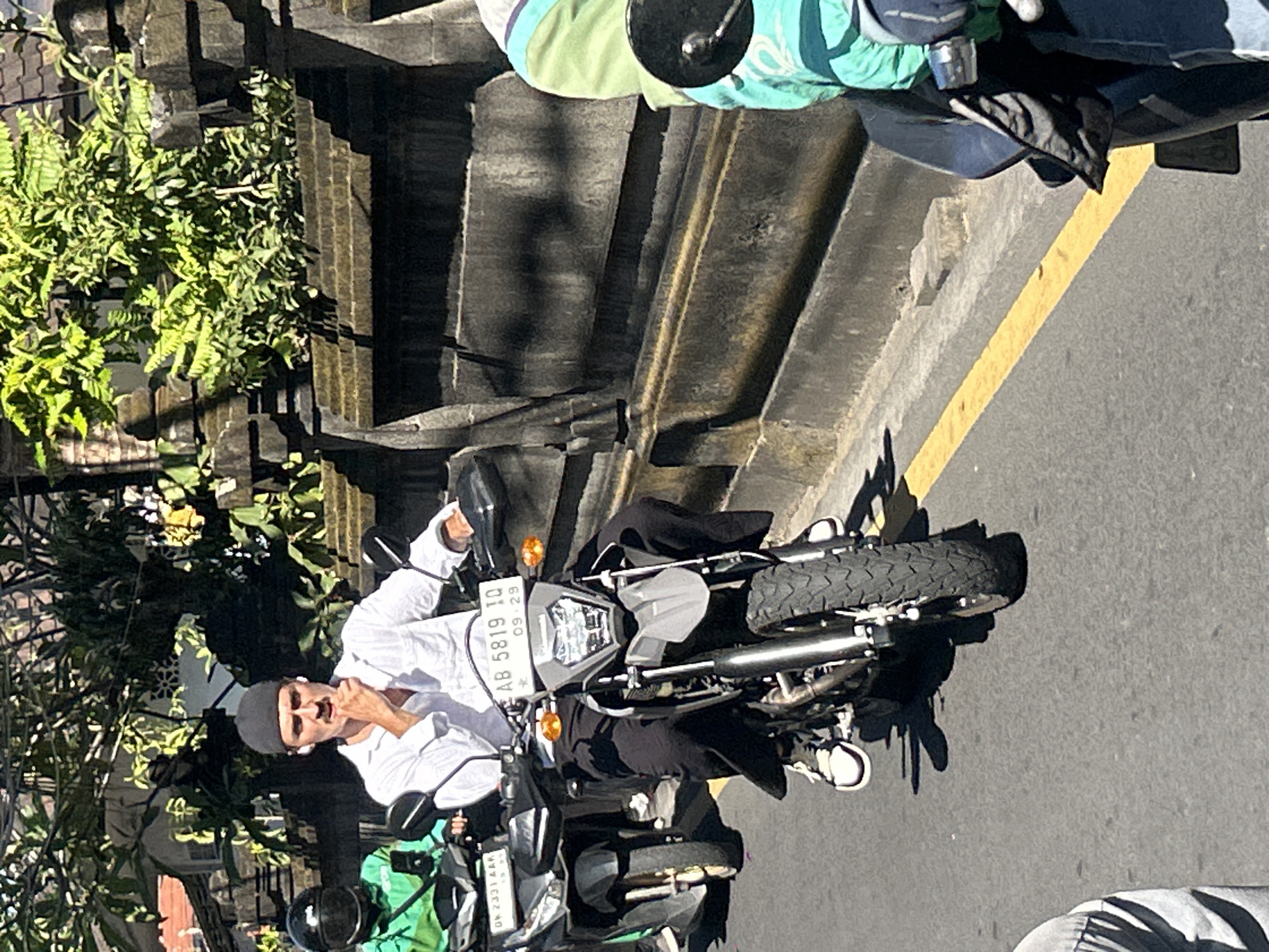 Morning scooter traffic flows through North Kuta, Bali