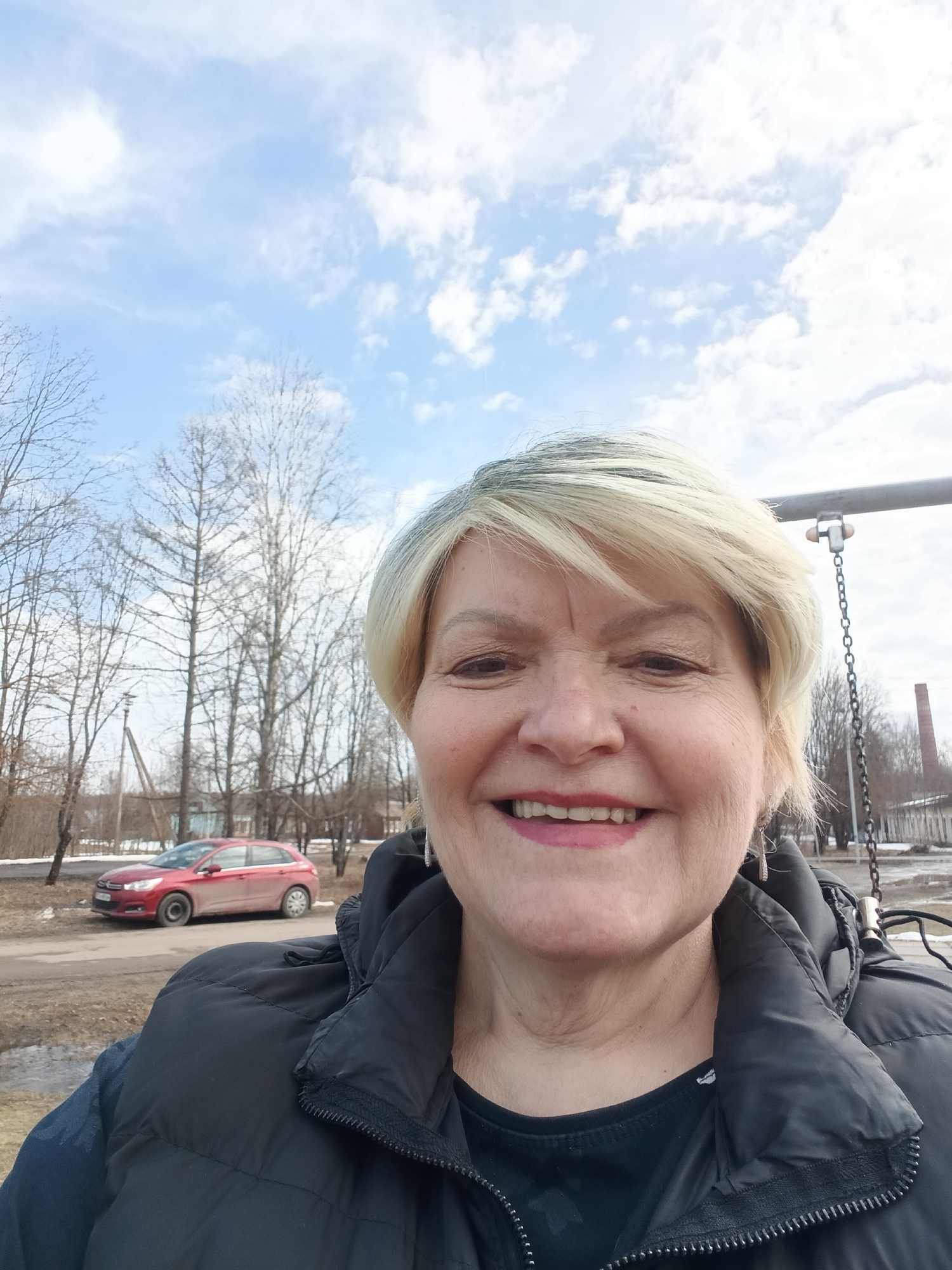 Woman takes selfies at playground in Красный Маяк