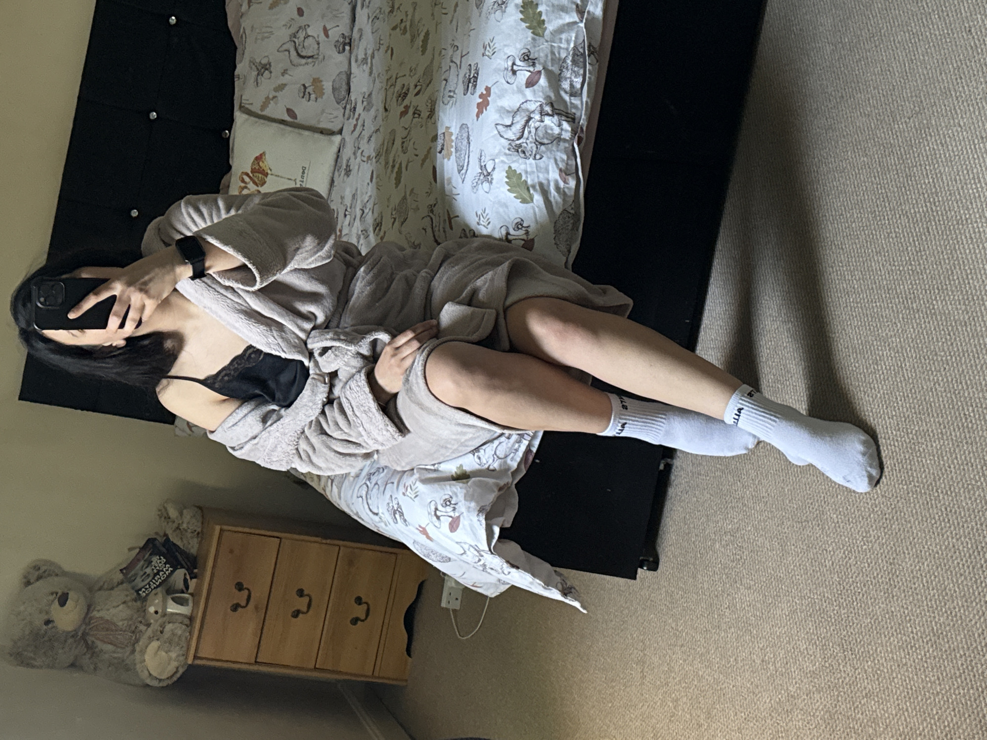 Woman photographs from bed in Great Yarmouth morning scene
