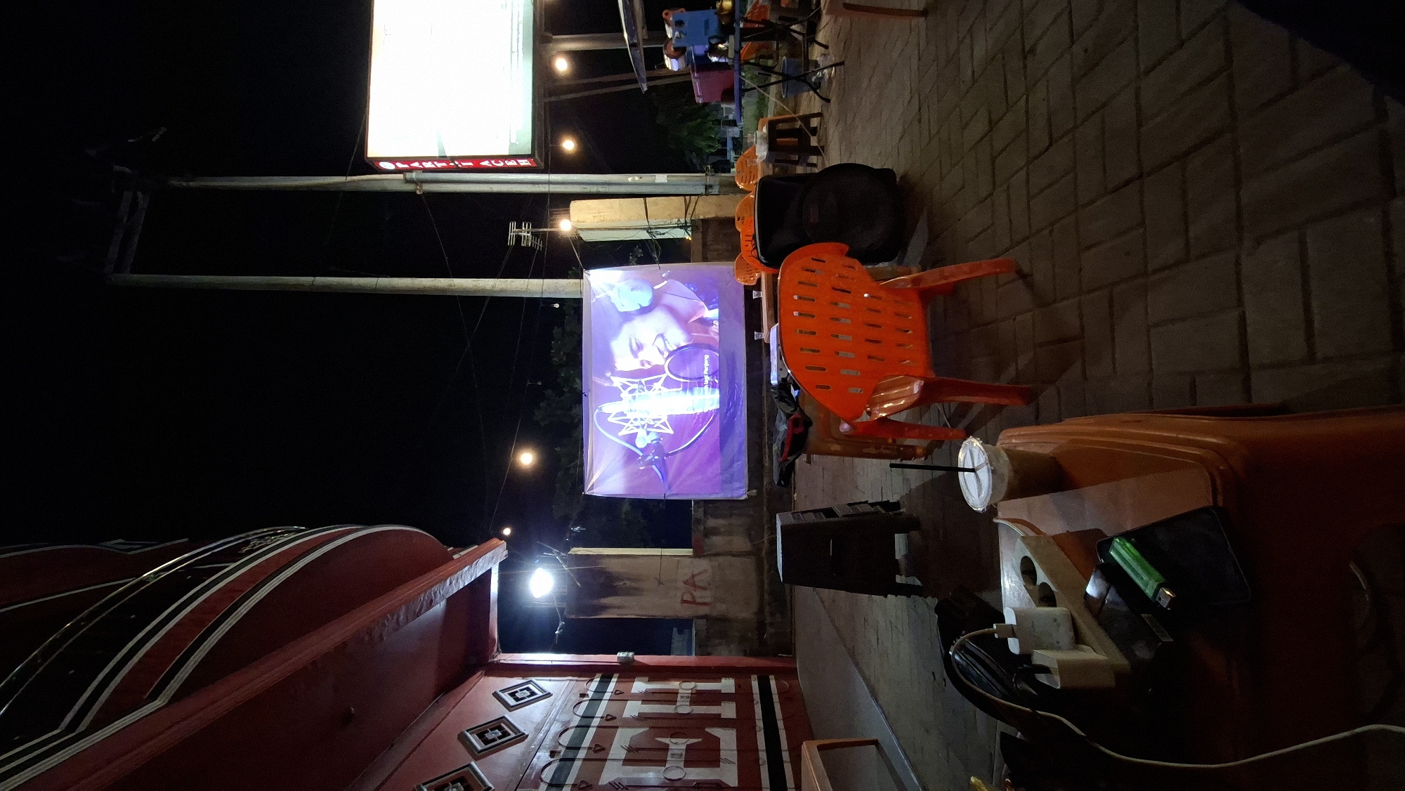 Outdoor projection night in Aceh: music and football on a street screen