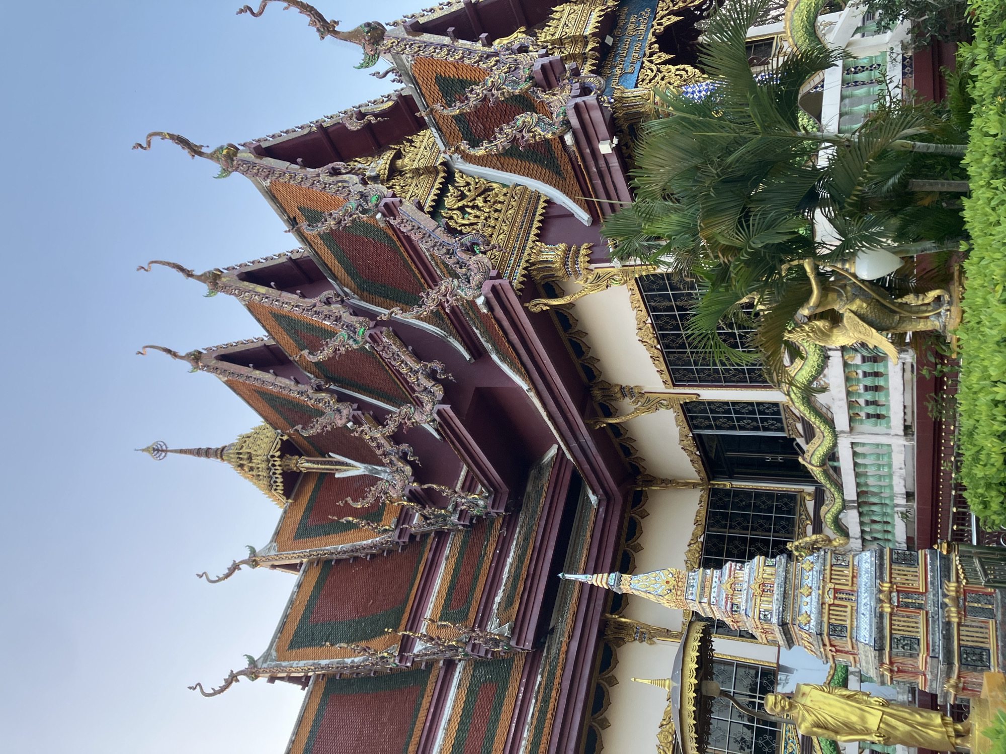 Visitors document ornate Wat Plai Laem temple complex in Thailand