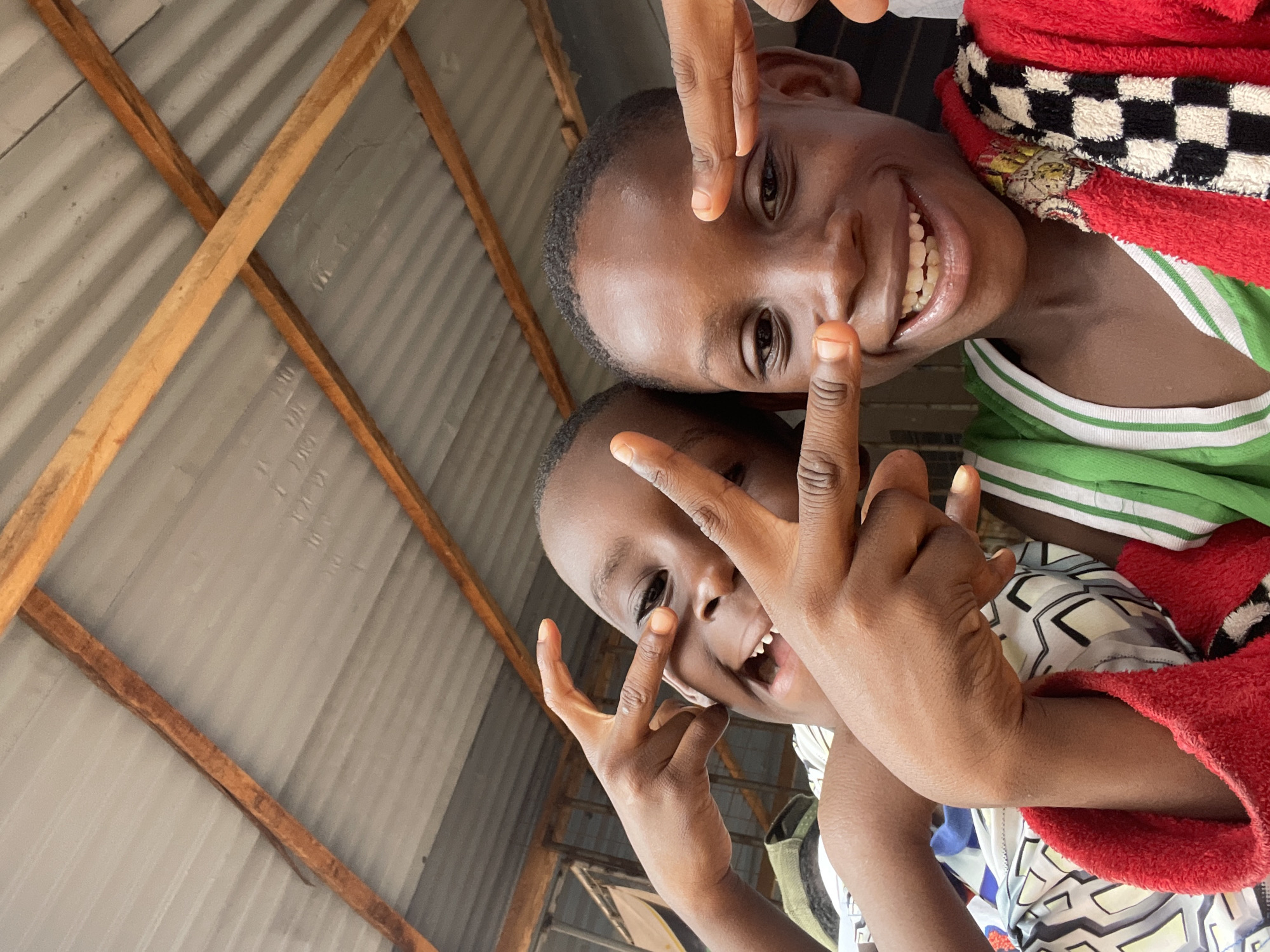 Arsenal fan flashes peace sign in Onitsha street