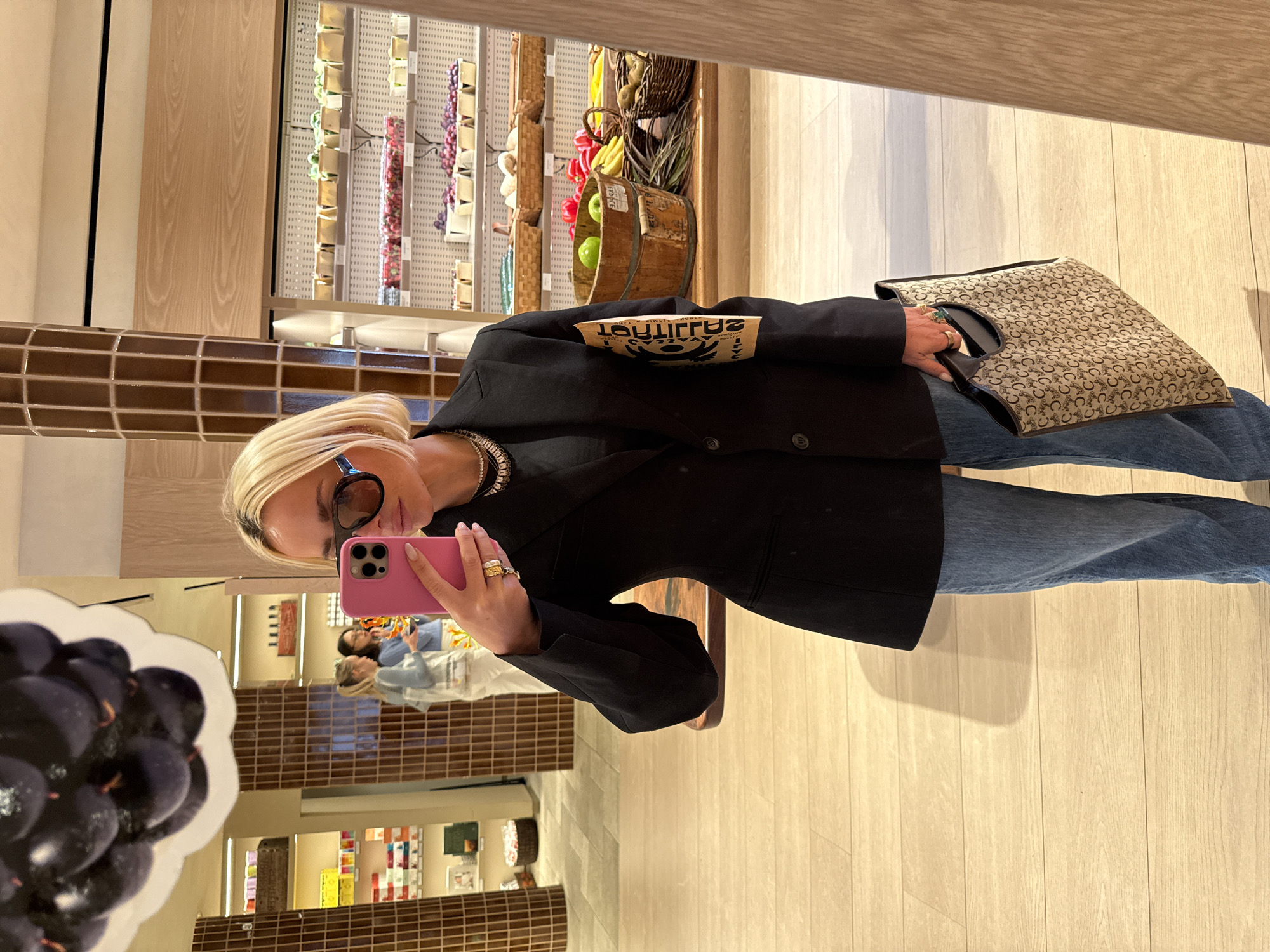 Visitor documents retail space with selfies, displays in NYC