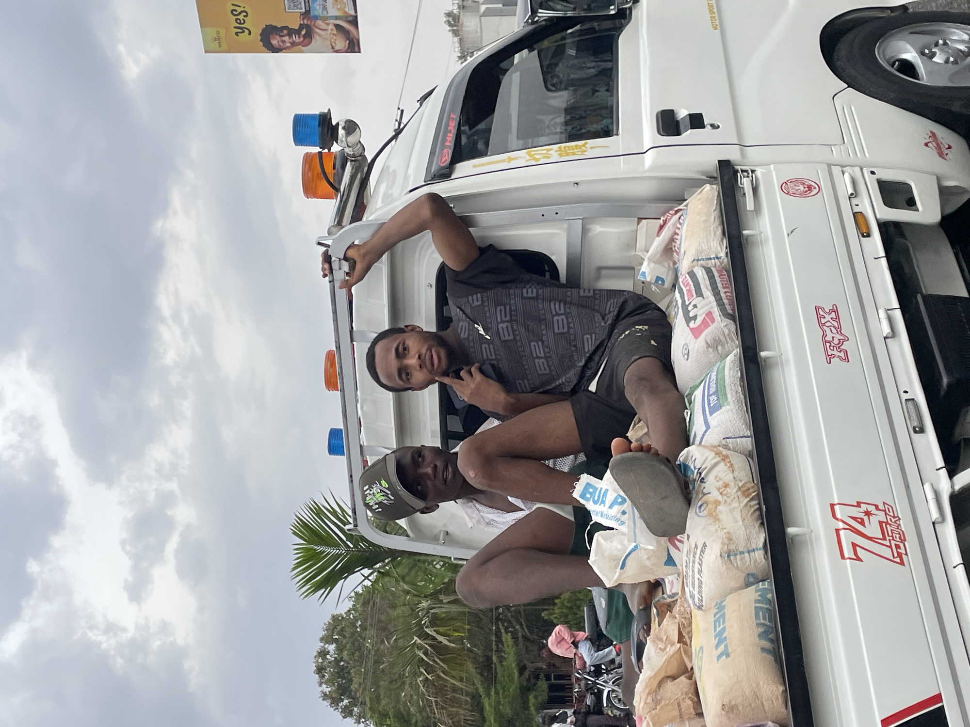 Daily life moments captured in Jos: cement transport, children skating