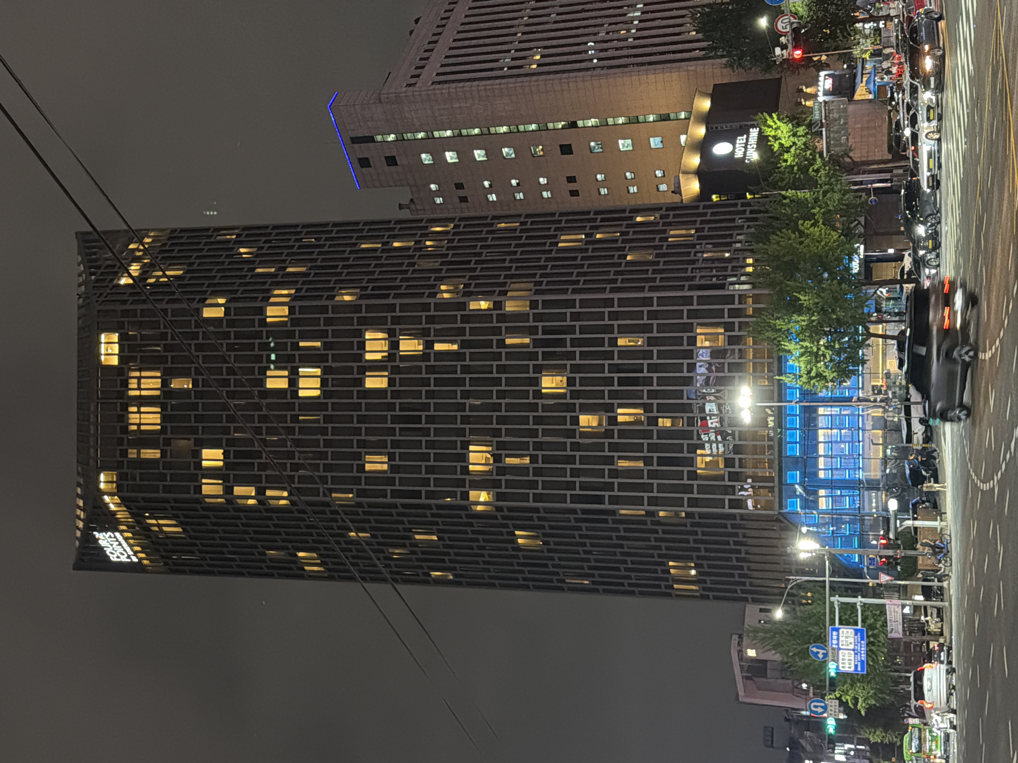 Nighttime street scene on a quiet Seoul block