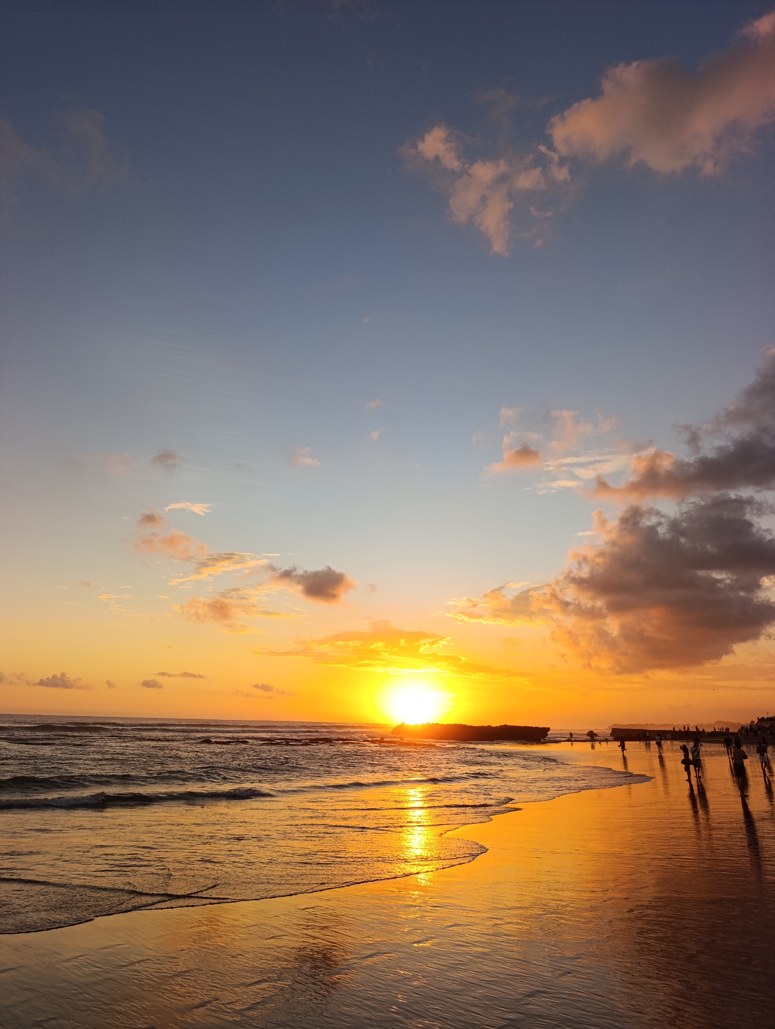 Sunset observed over North Kuta beach with rock formation
