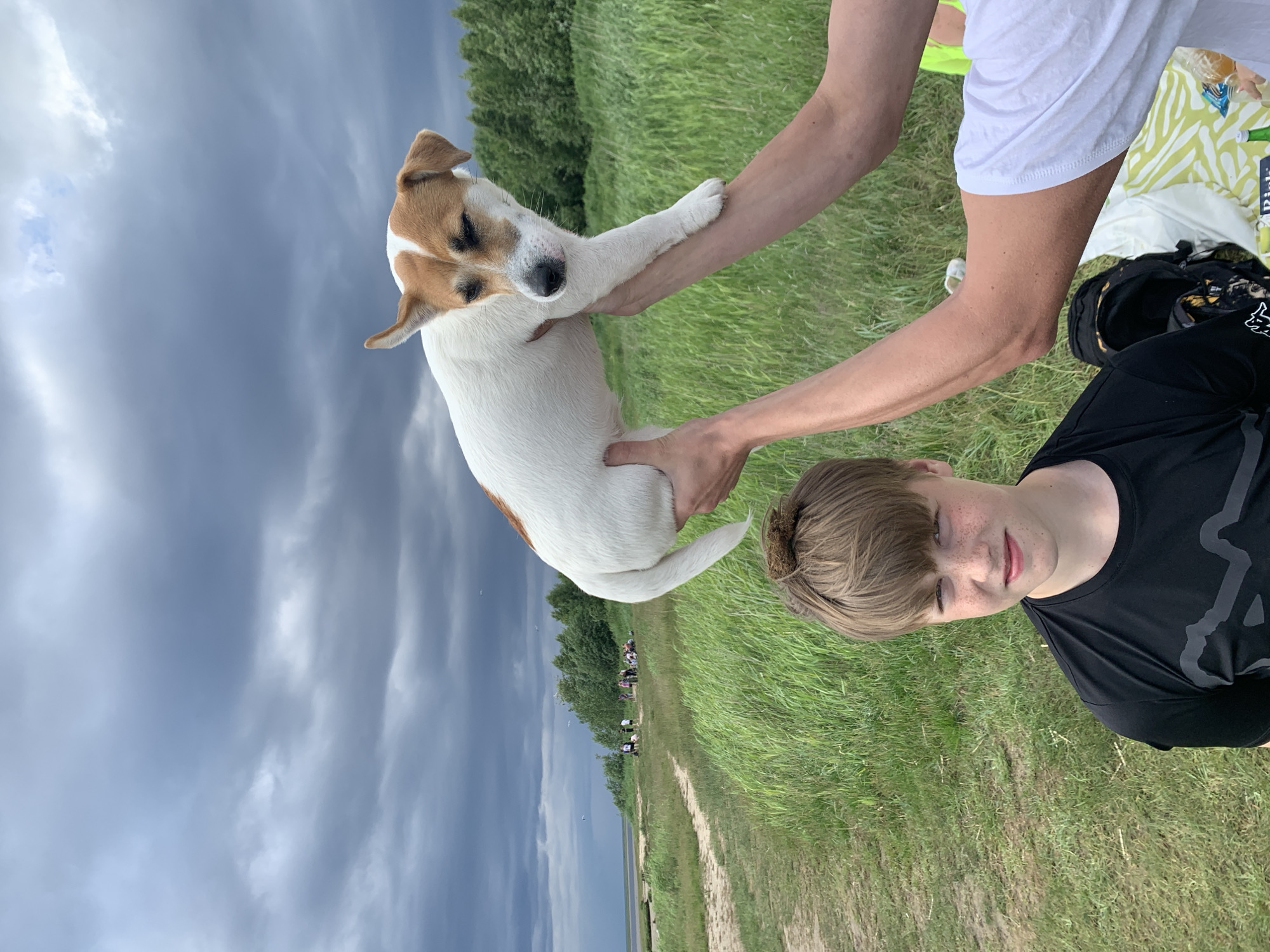 Cloudy summer day by the water in Severodvinsk, dog in tow