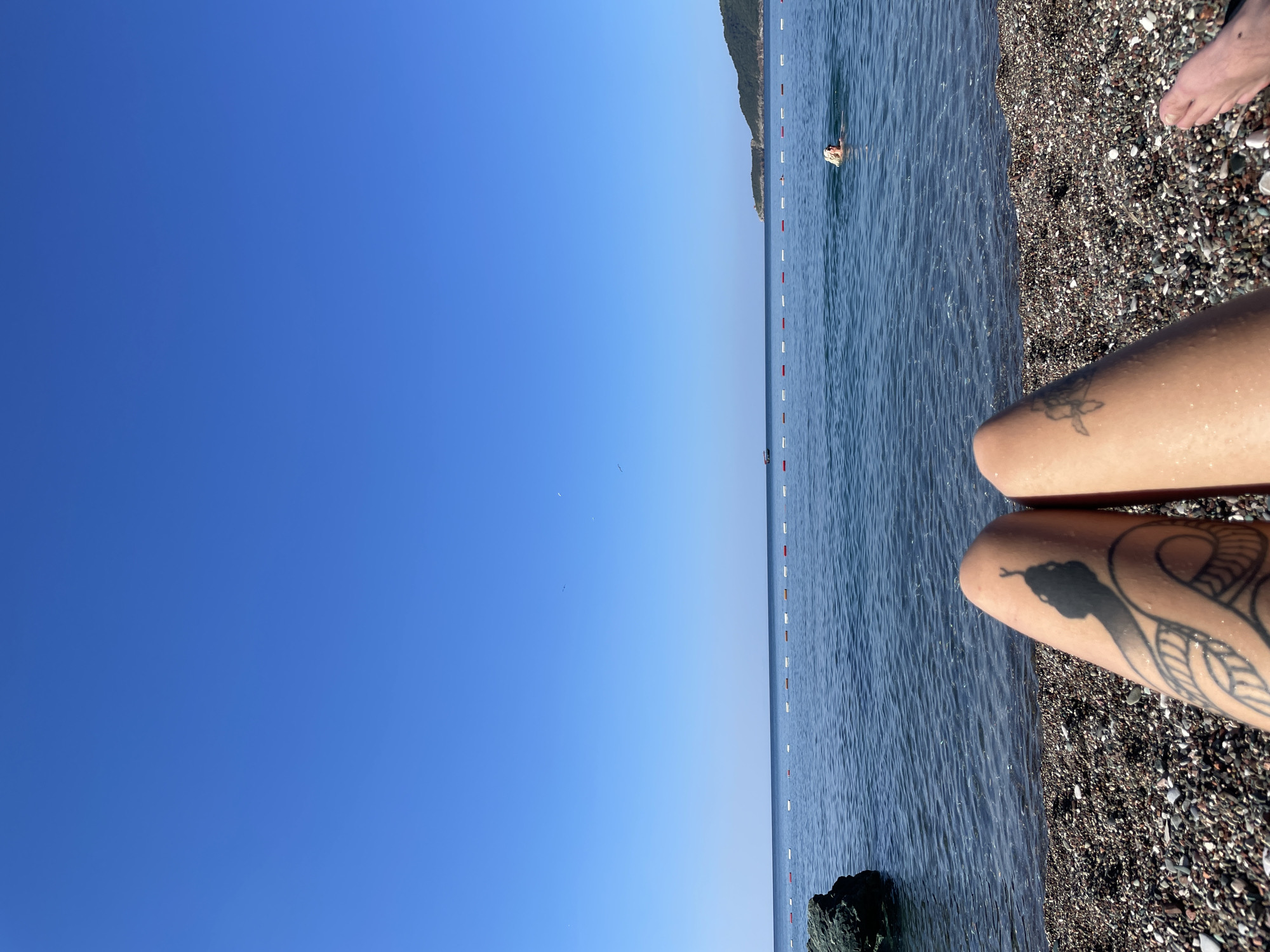Lazy summer afternoon on a pebble beach in Montenegro