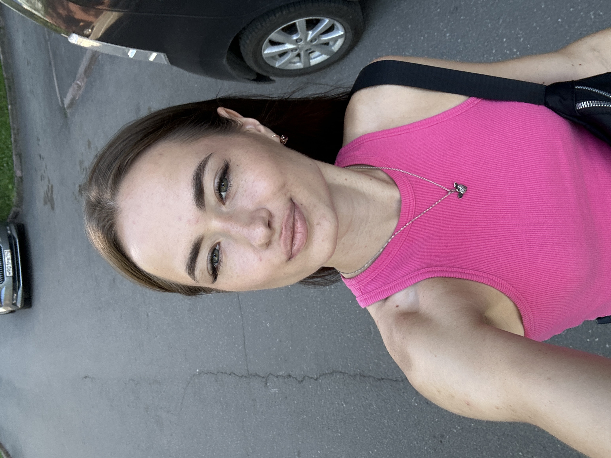 Sunny day selfies near blooming peonies and city buildings