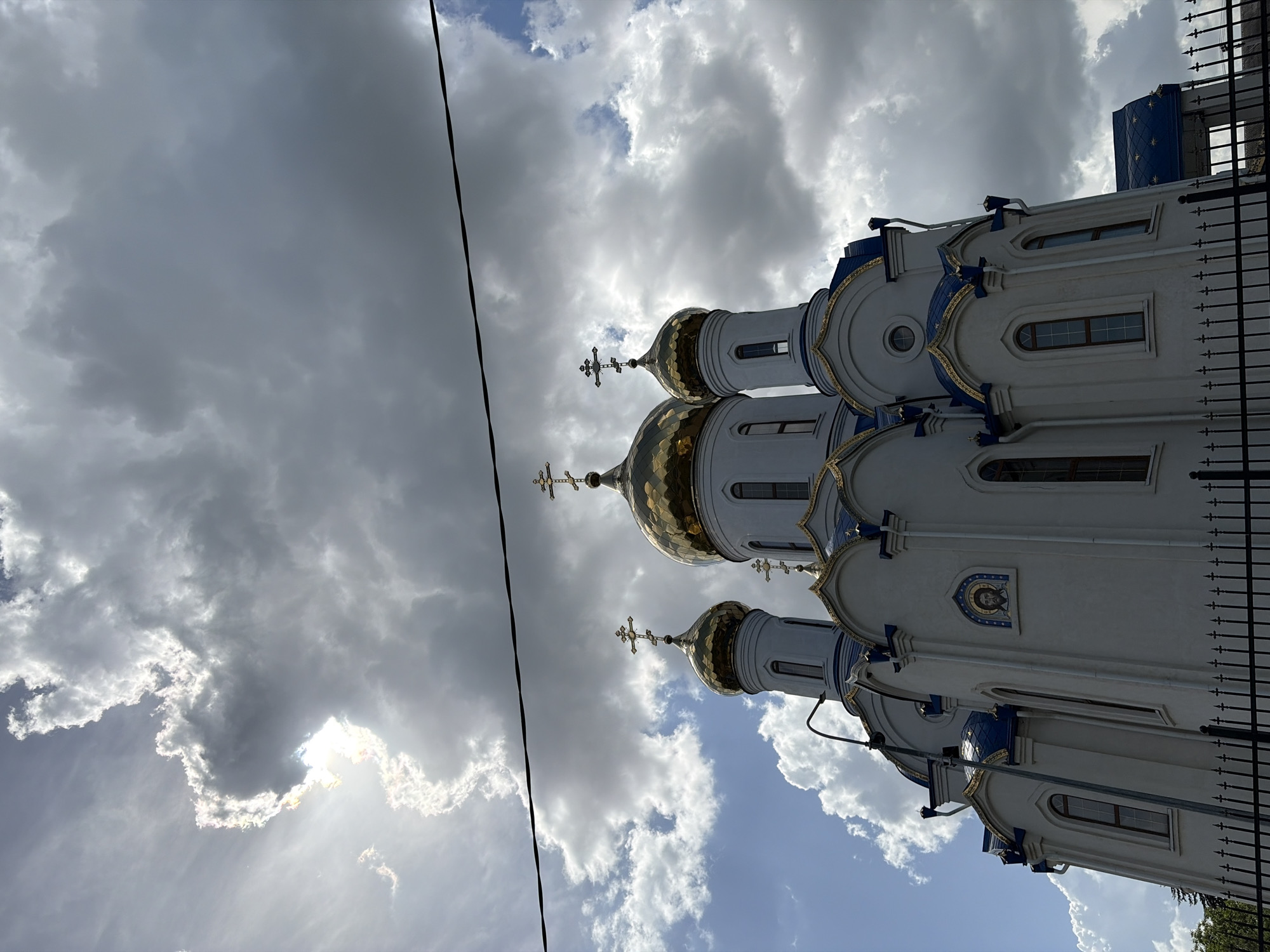 Orthodox church with golden domes photographed in Novopokrovskaya, Russia