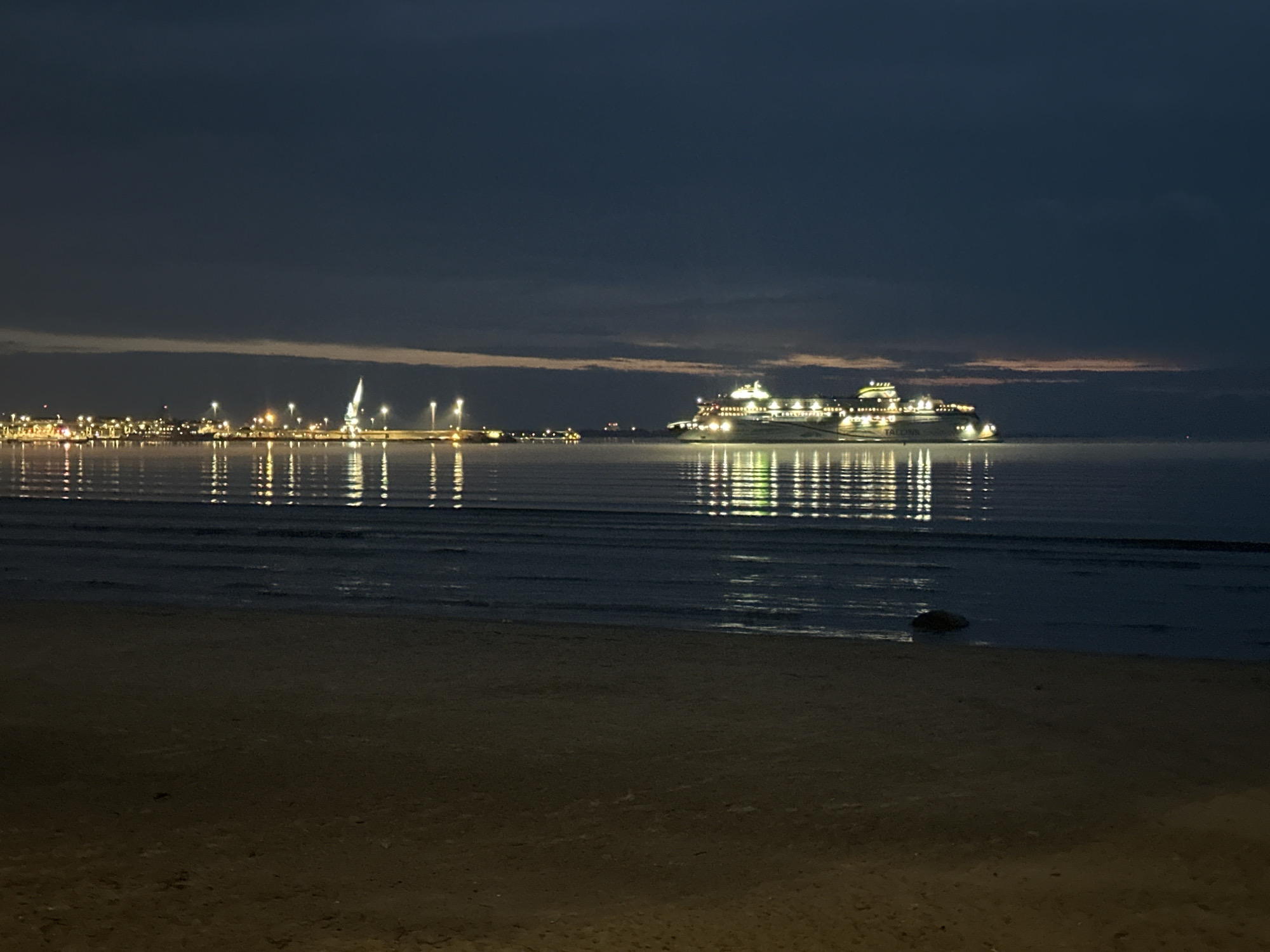 Evening stroll documented along Tallinn's illuminated waterfront and beaches