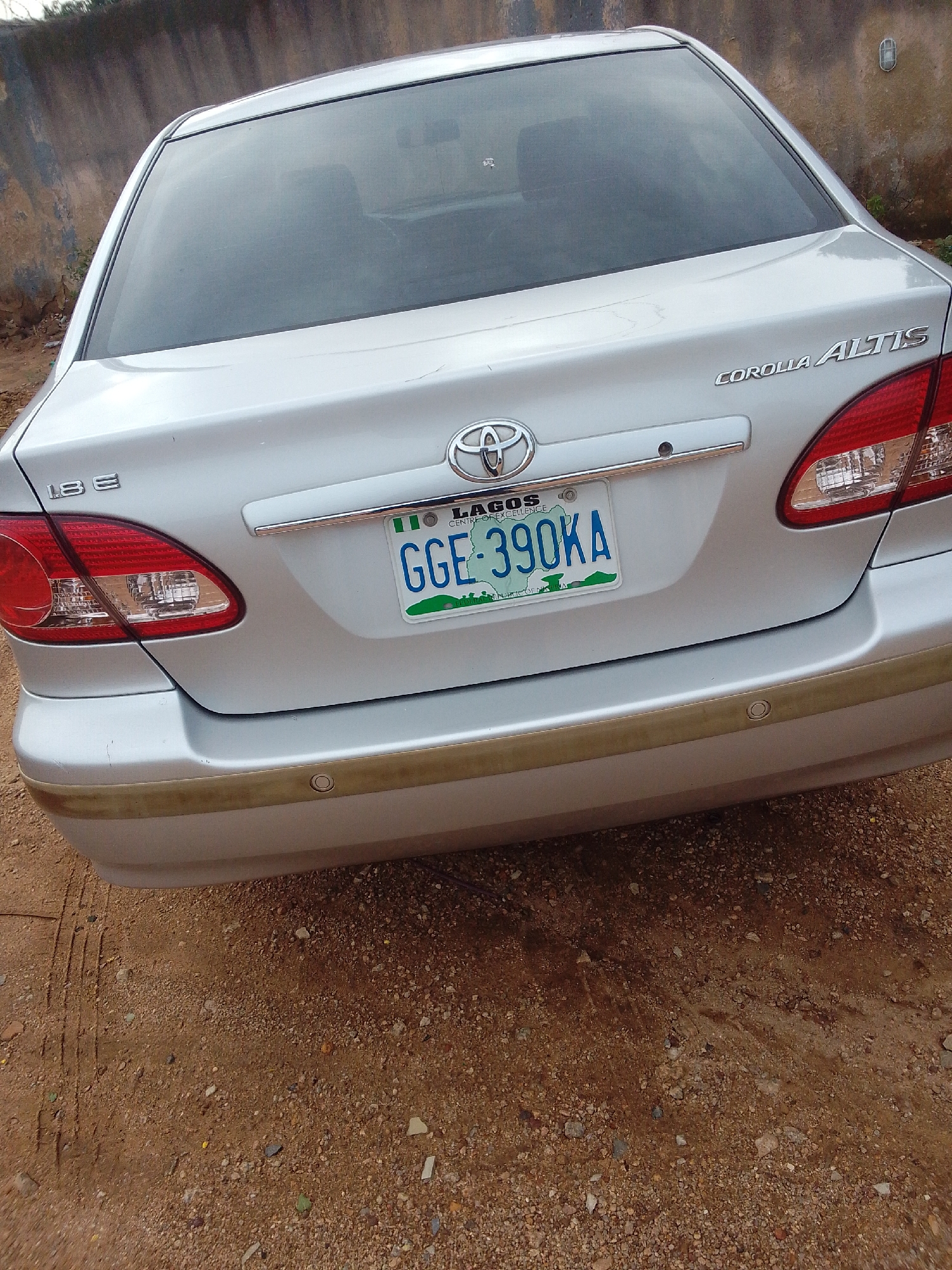 Silver Toyota parked near Amazon Hotel, license documented