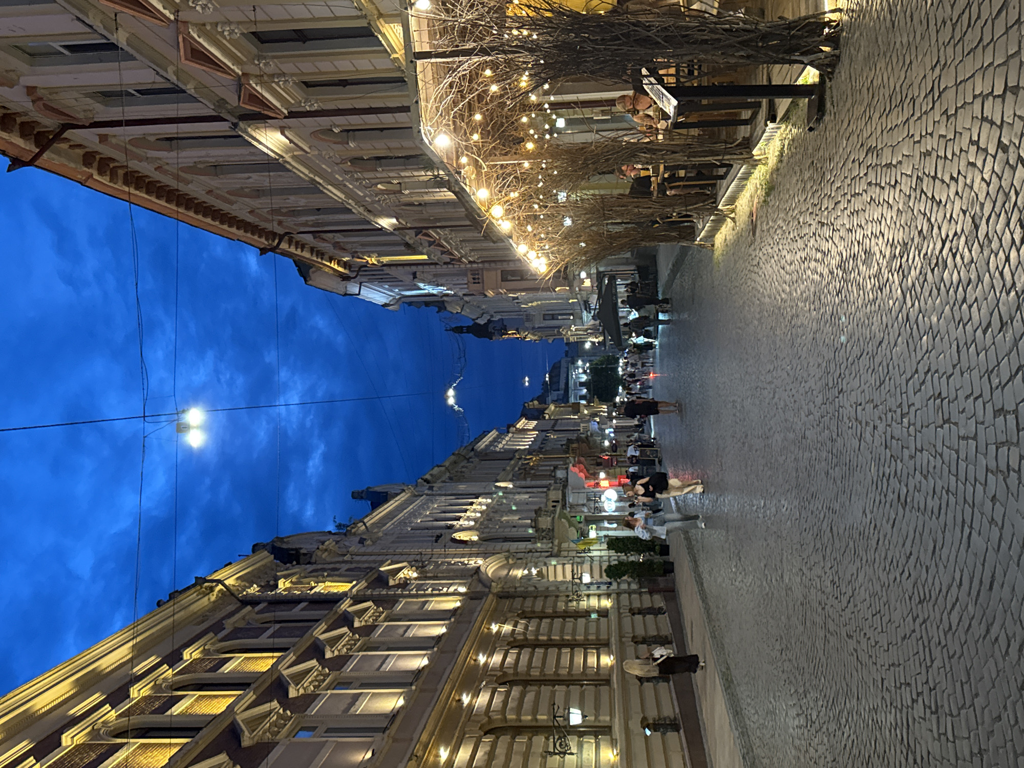 Chernivtsi's historic center at dusk, cafes and cobblestones