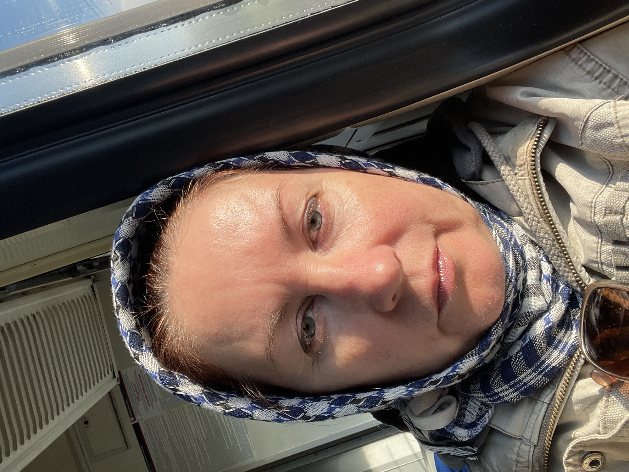 Woman Takes Selfie Near Window in Naumovo, Russia