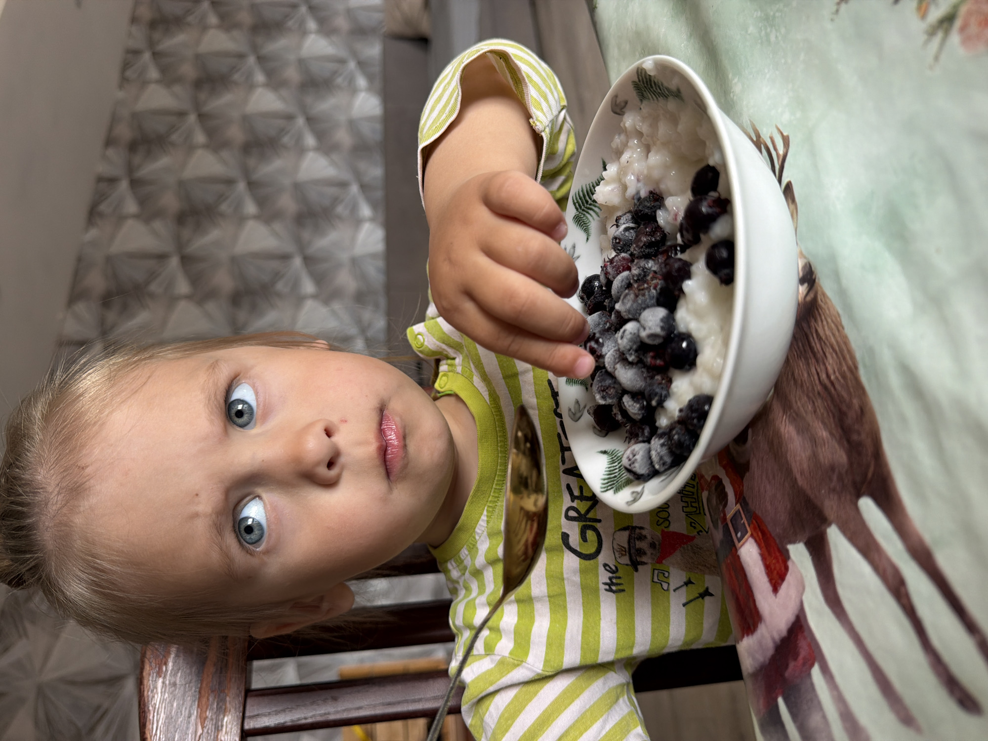 Child's breakfast documented in Chaikovsky, Russia morning scene
