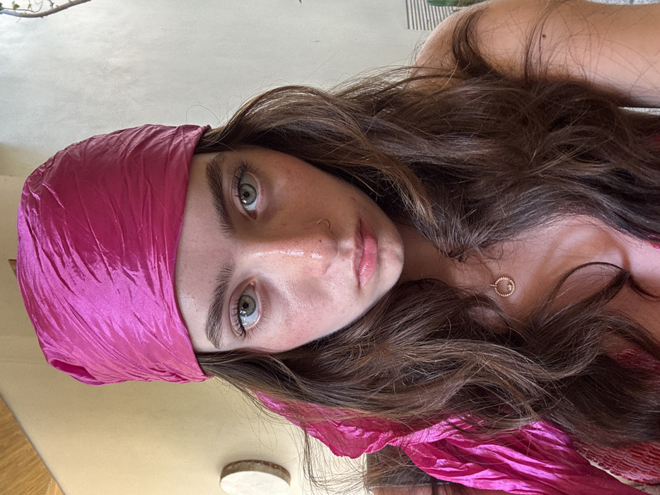 Woman poses for photos in pink attire, Mexico beach town