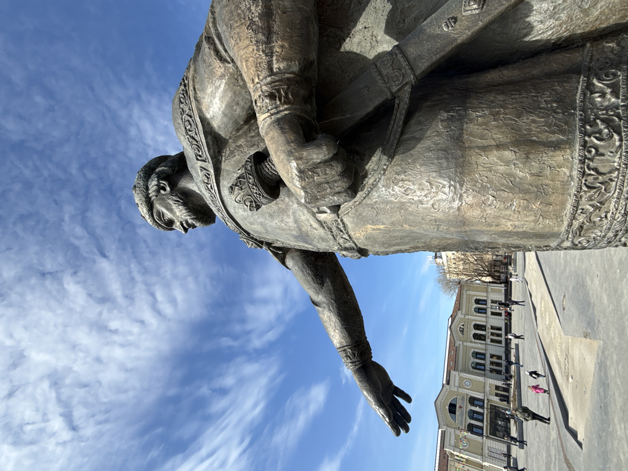 Tourists photograph historic Yuri Dolgoruky statue in Dmitrov