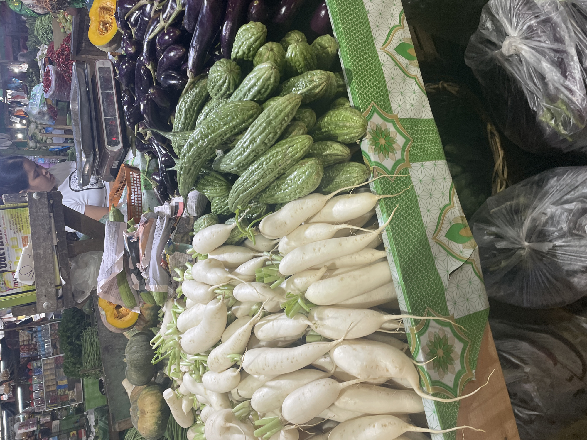 Fresh produce and active construction at a busy Davao morning