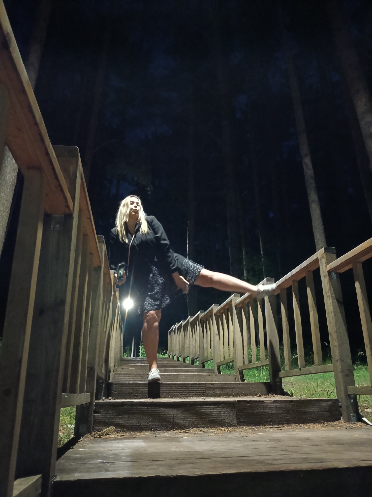 Late-night photo session on a forest boardwalk in Chaikovsky