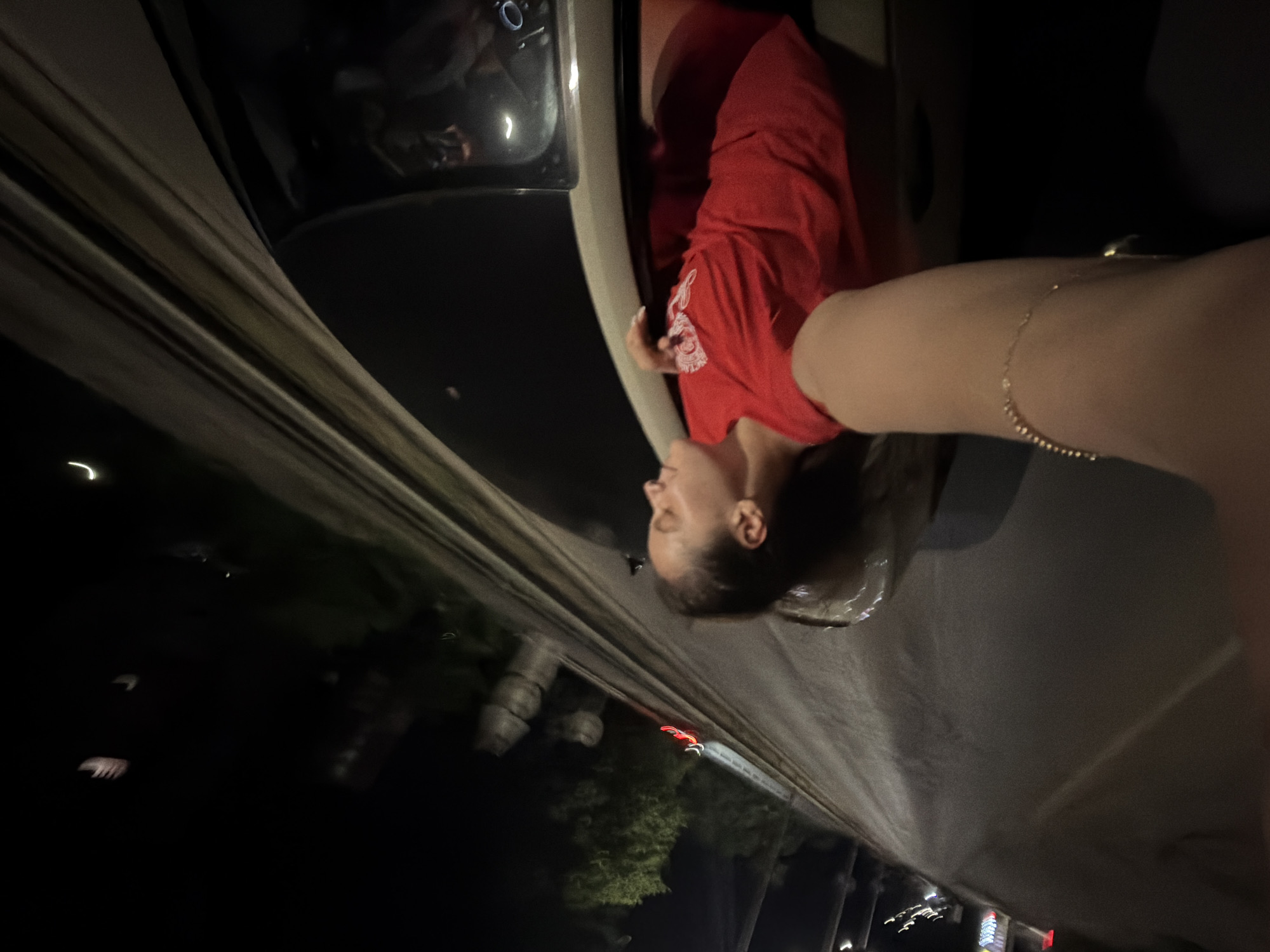 Woman enjoys nighttime car ride in Ruse, Bulgaria