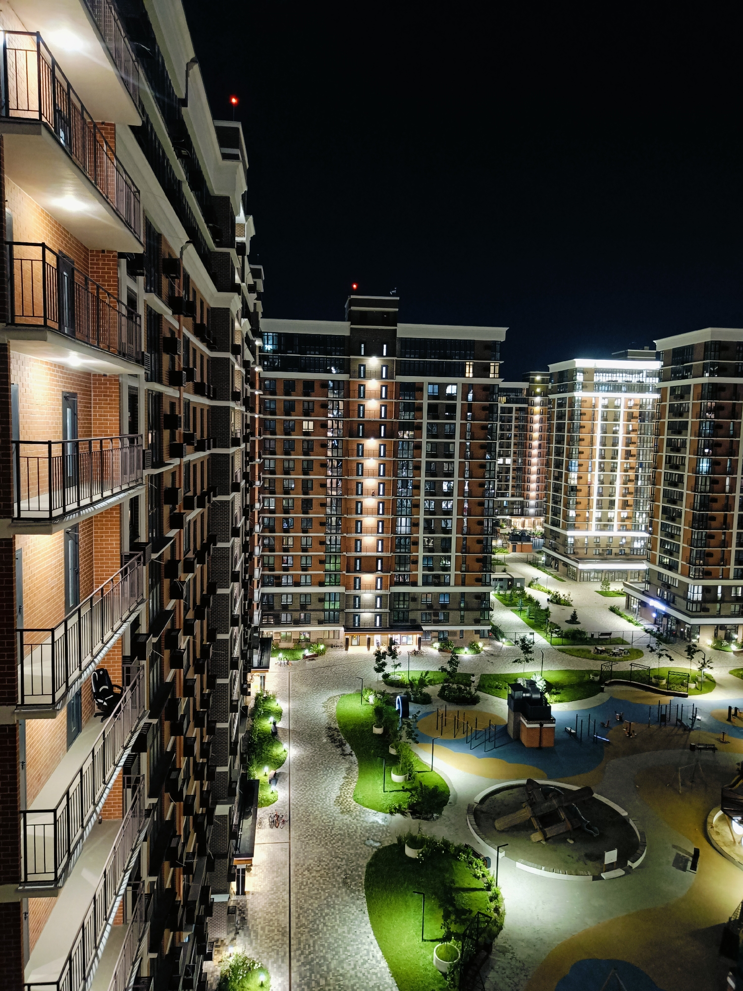 Krasnodar apartment complex lit up on a summer night