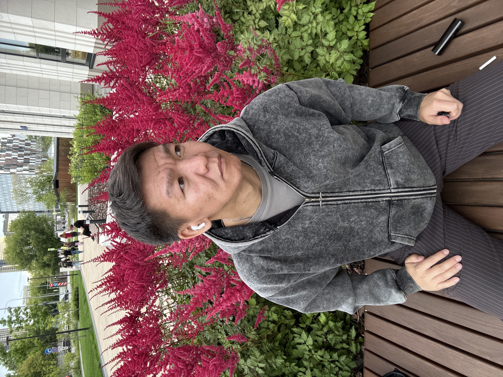 Afternoon in a Khimki park, bench and blooming astilbe flowers.