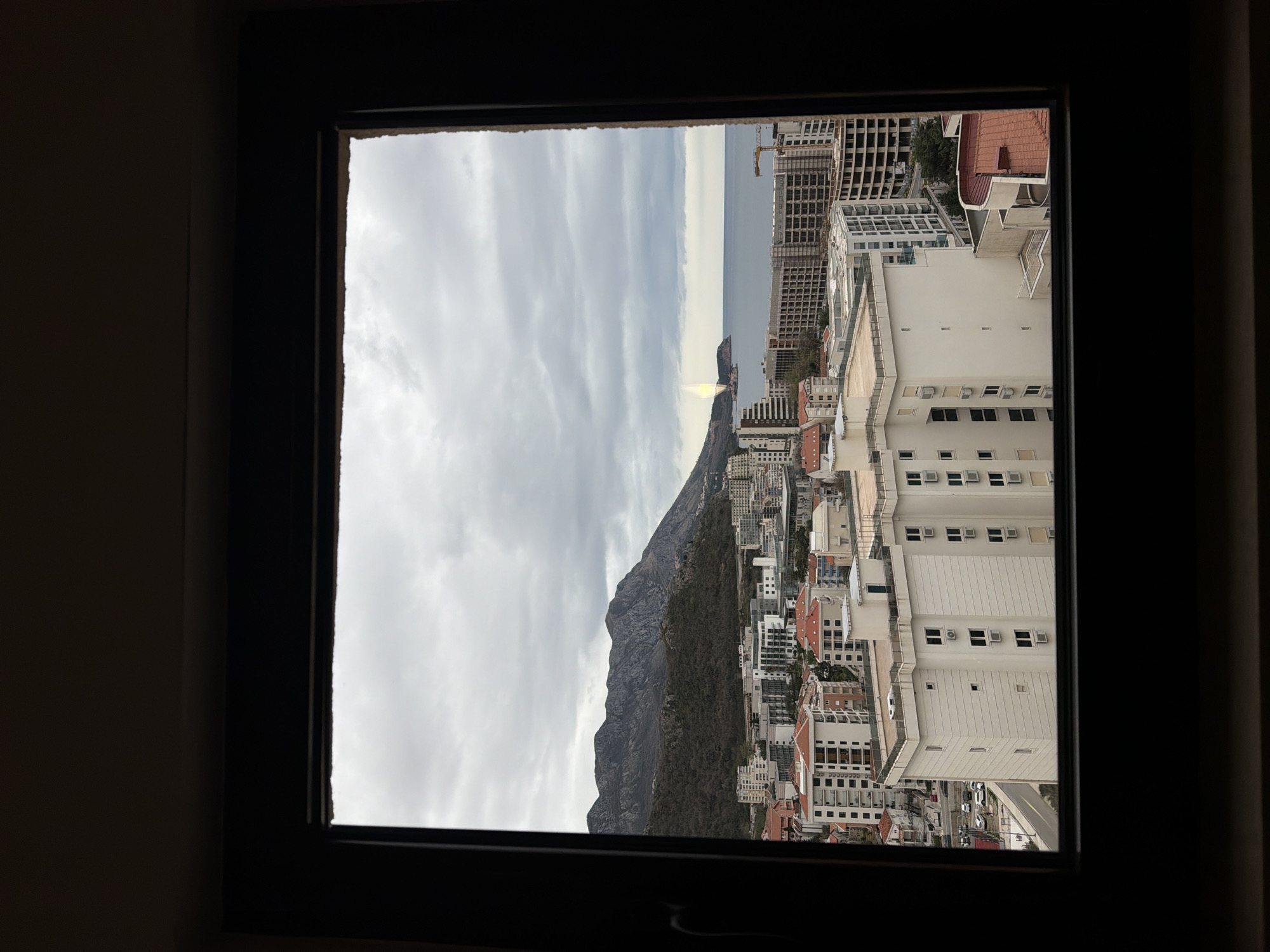 Cloudy mountain view captured from window in Boreti, Montenegro