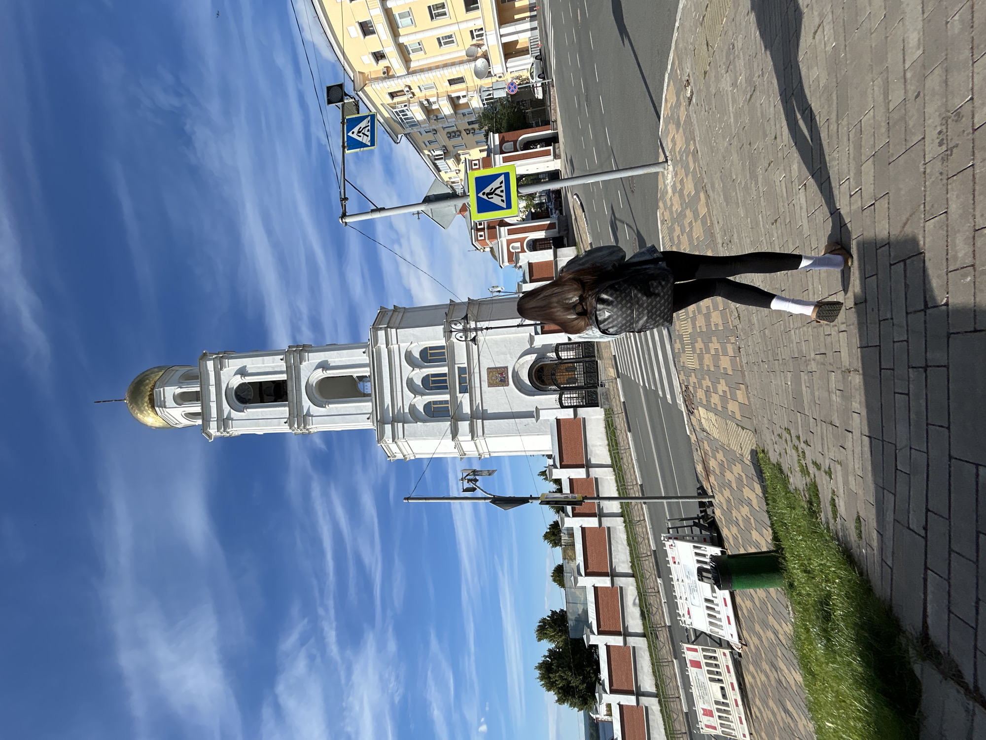 Casual afternoon stroll on a Samara sidewalk