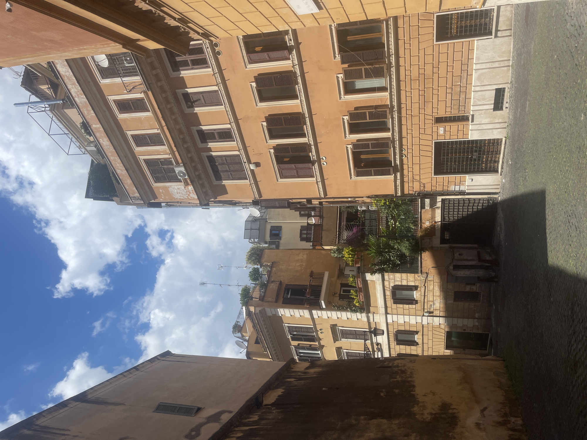 Tourist documents leisurely morning walk through historic Rome streets