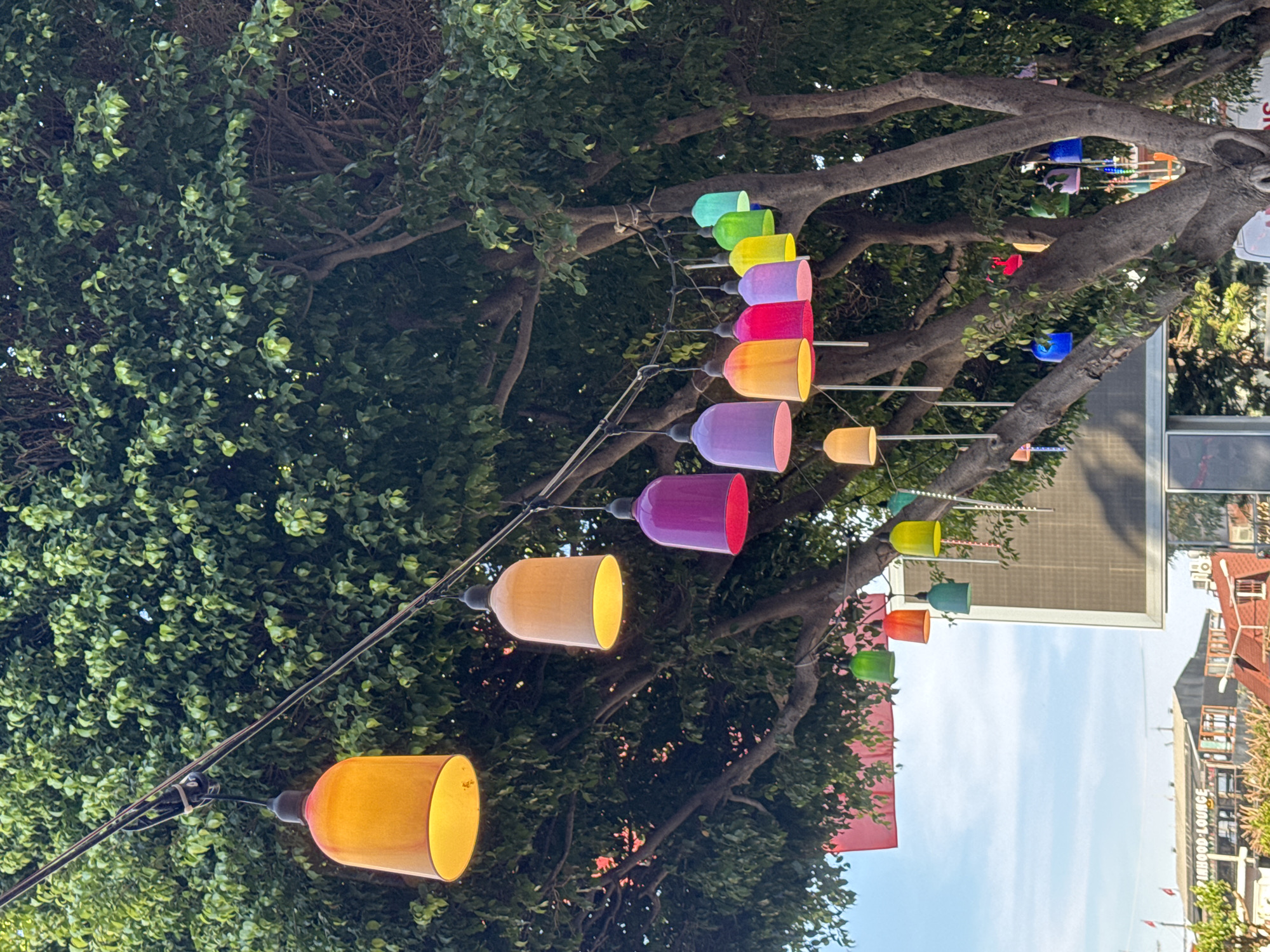 Colorful bell lights illuminate street scene in Alanya, Turkey