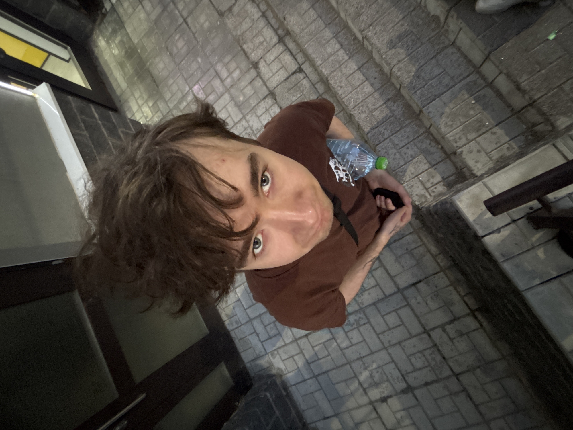 Friends messing around with camera angles in an urban setting