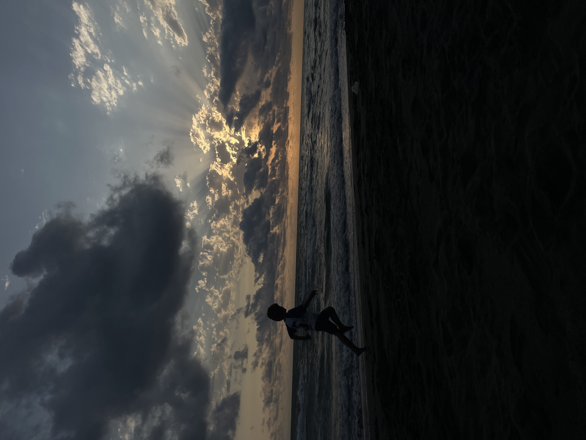 Stormy sunset light breaks through clouds over the Black Sea