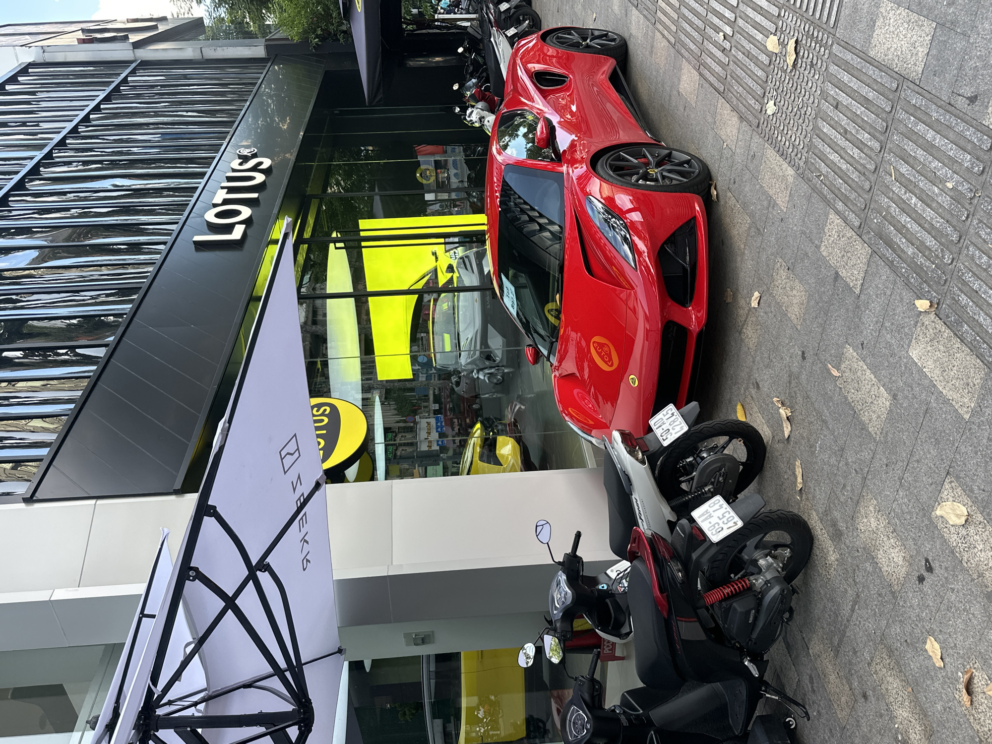 Thủ Đức streets, a Lotus dealership, and a café morning