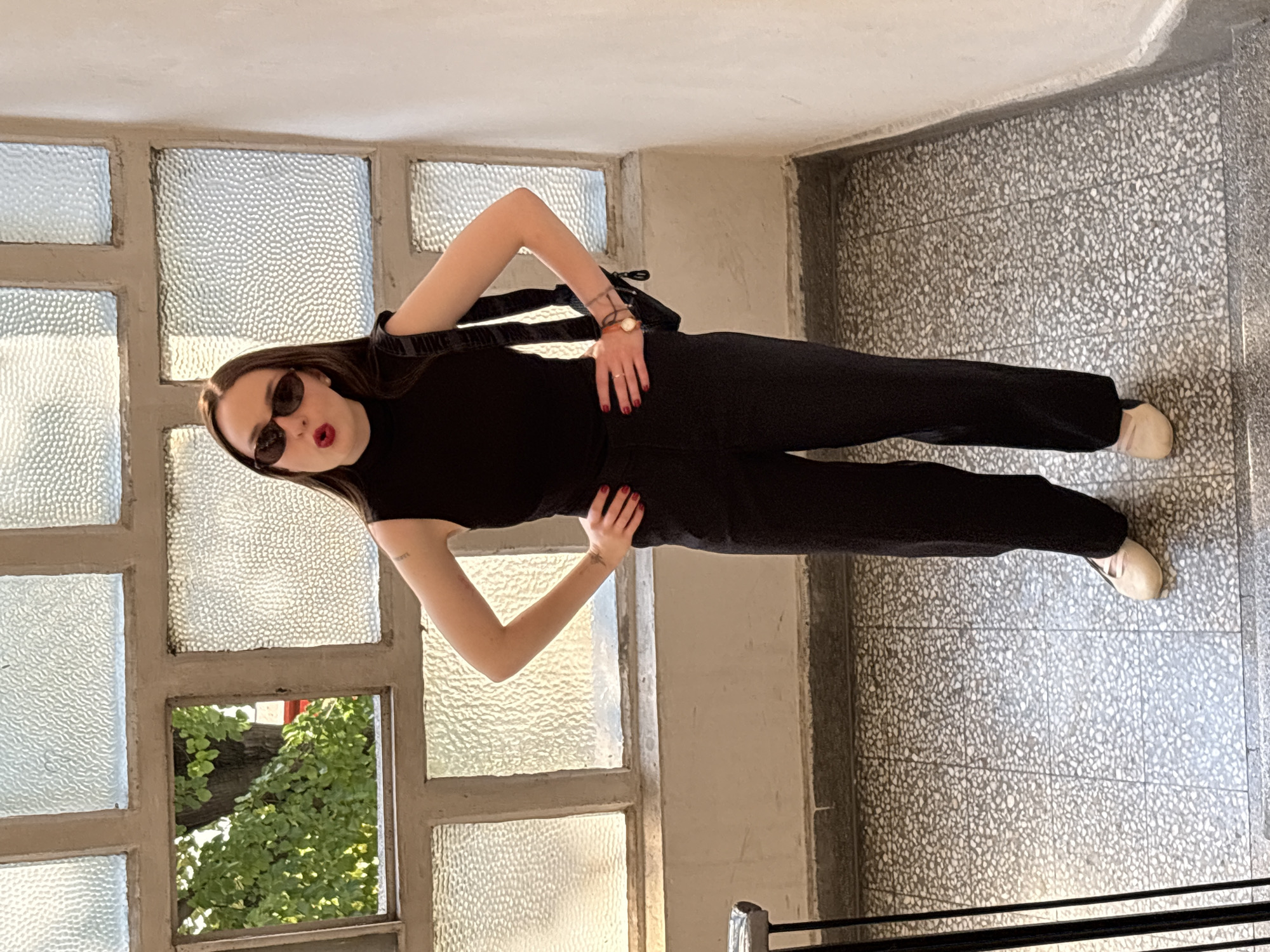 Indoor portraits around a Belgrade stairwell, same outfit, same day.