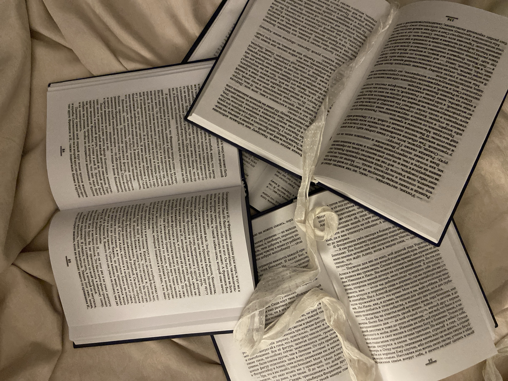 Books and mirror arranged on bed in Budva bedroom