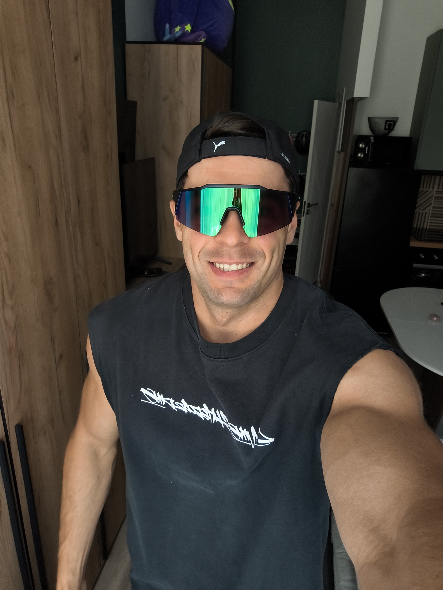 Man takes smiling selfie in Moscow residential space